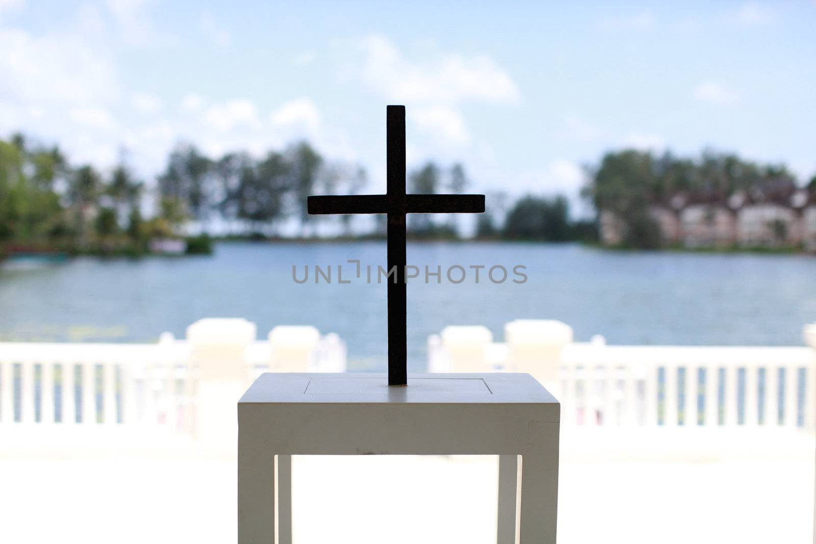 Metal cross at an alter in a church.