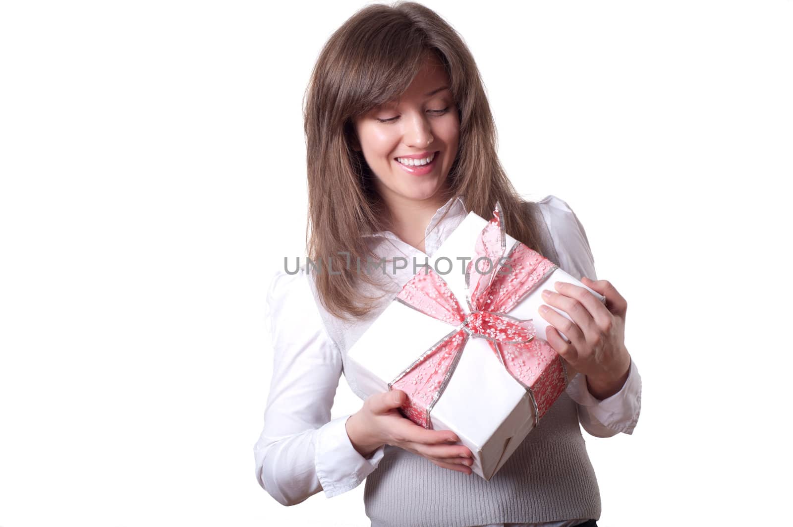 Young smiling woman holding gift - light box with a bow