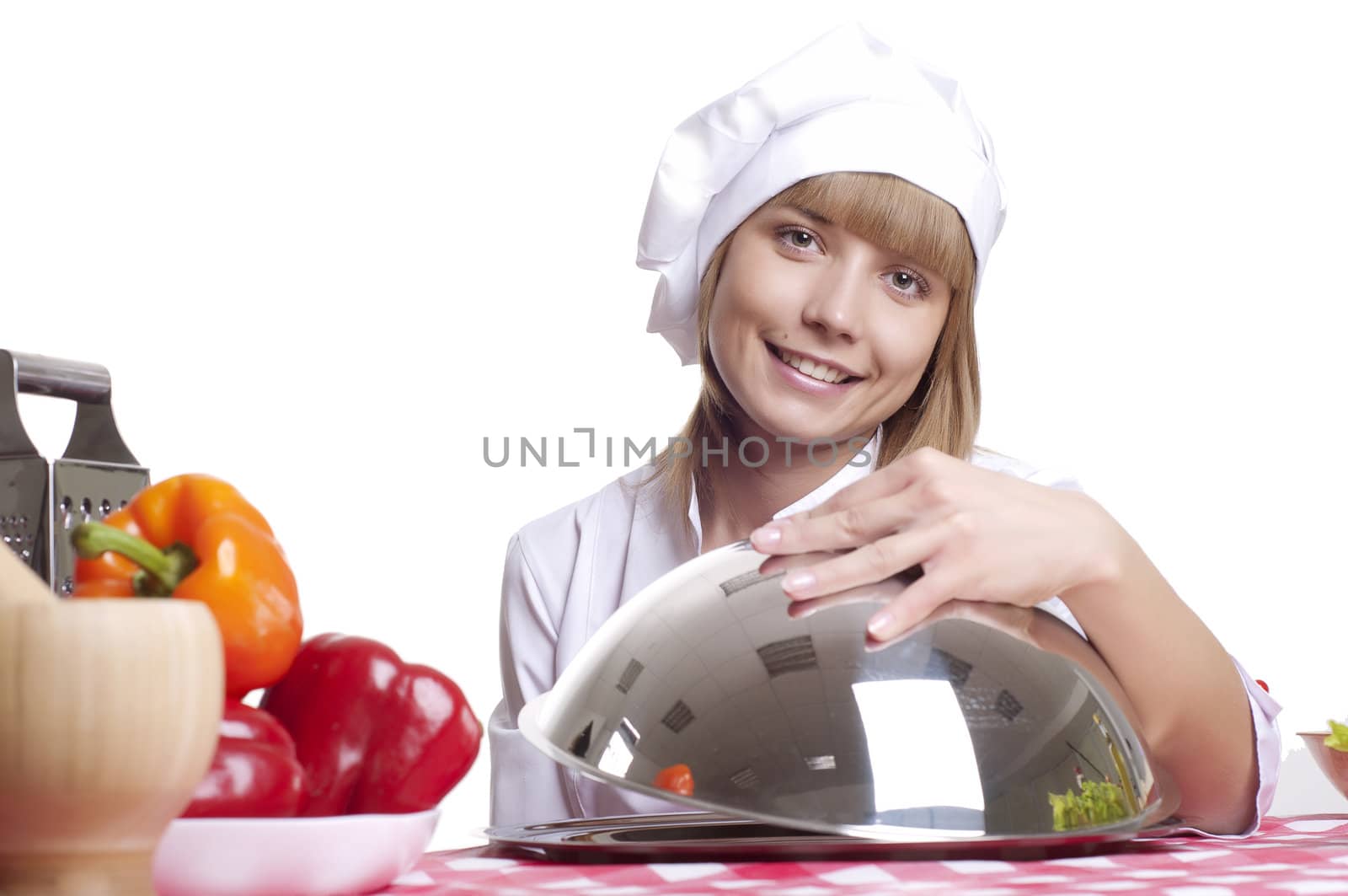 beautiful cook woman hold a metal dish with cooked food