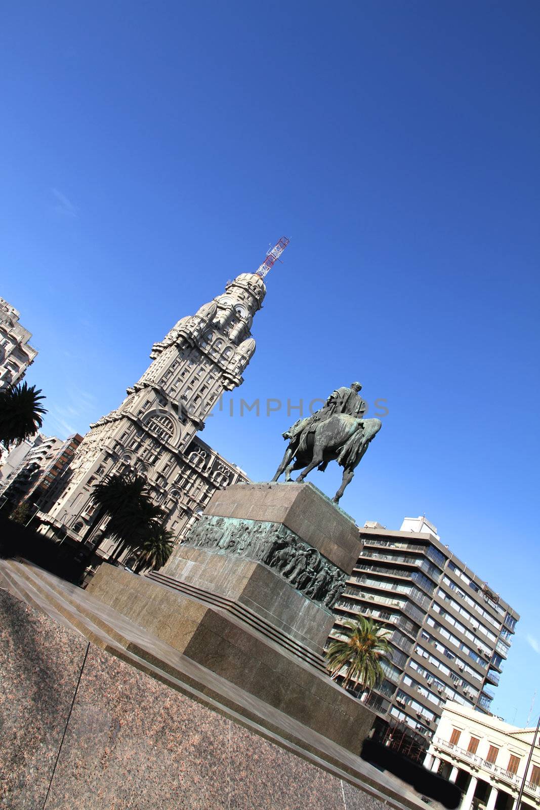 The Plaza independencia in Montevideo, Uruguay. The Palacio Salvo in the Background and the Monument of the grave of General Artigas in the Foreground.