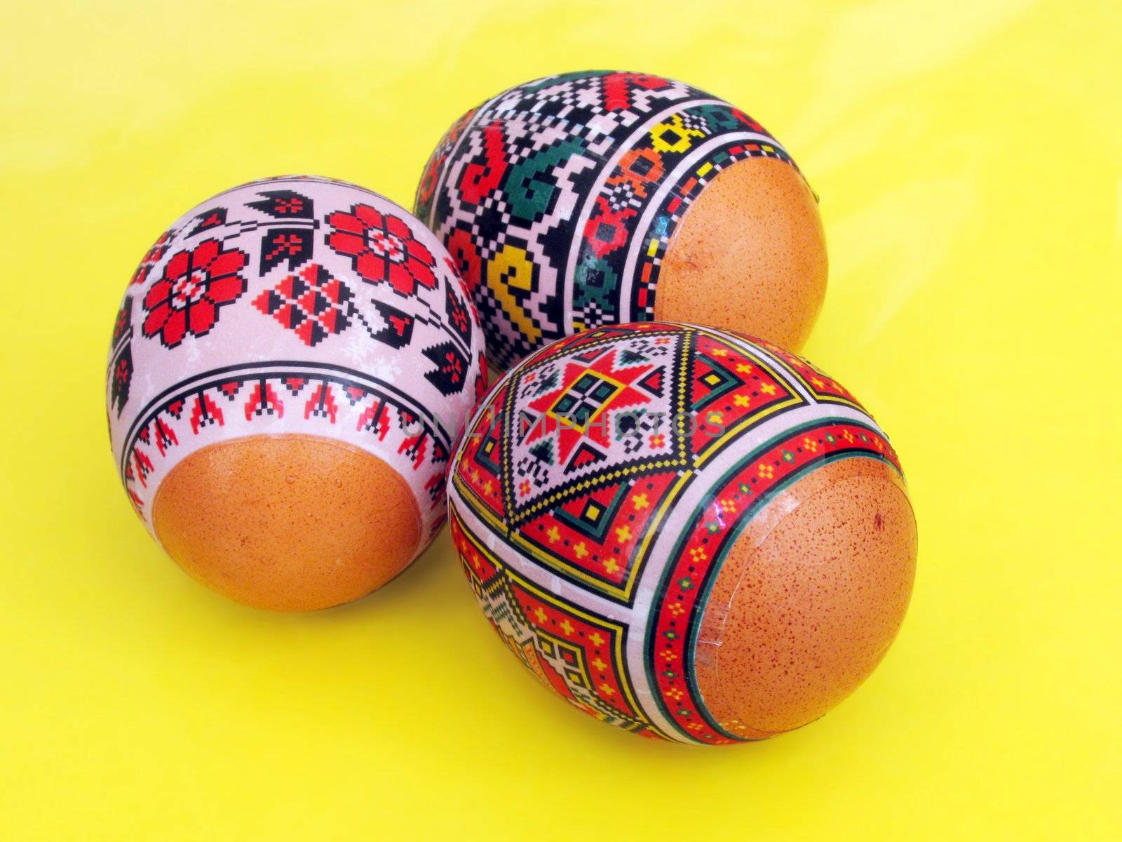 painted Easter eggs over yellow