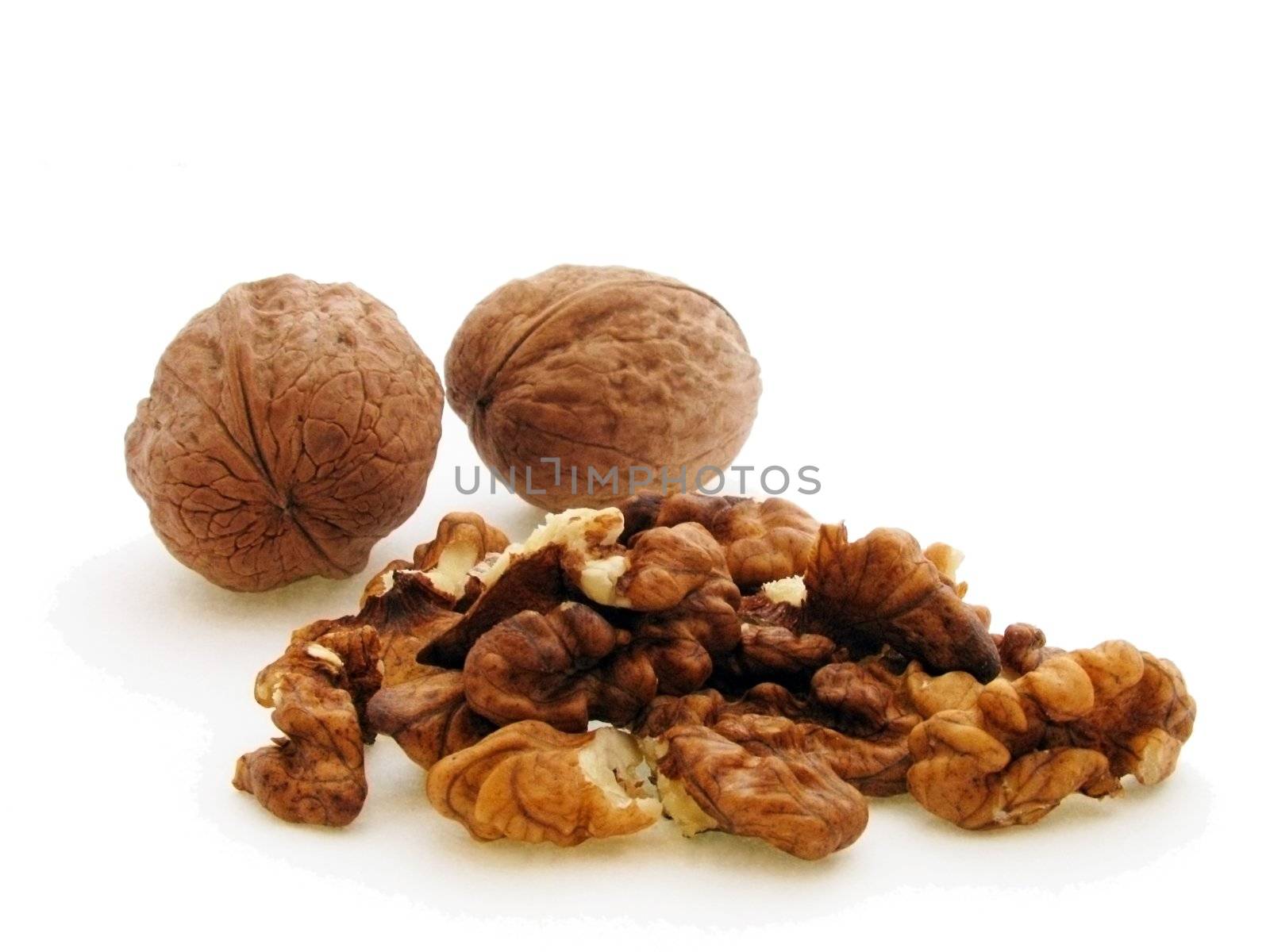 close up of walnuts over white