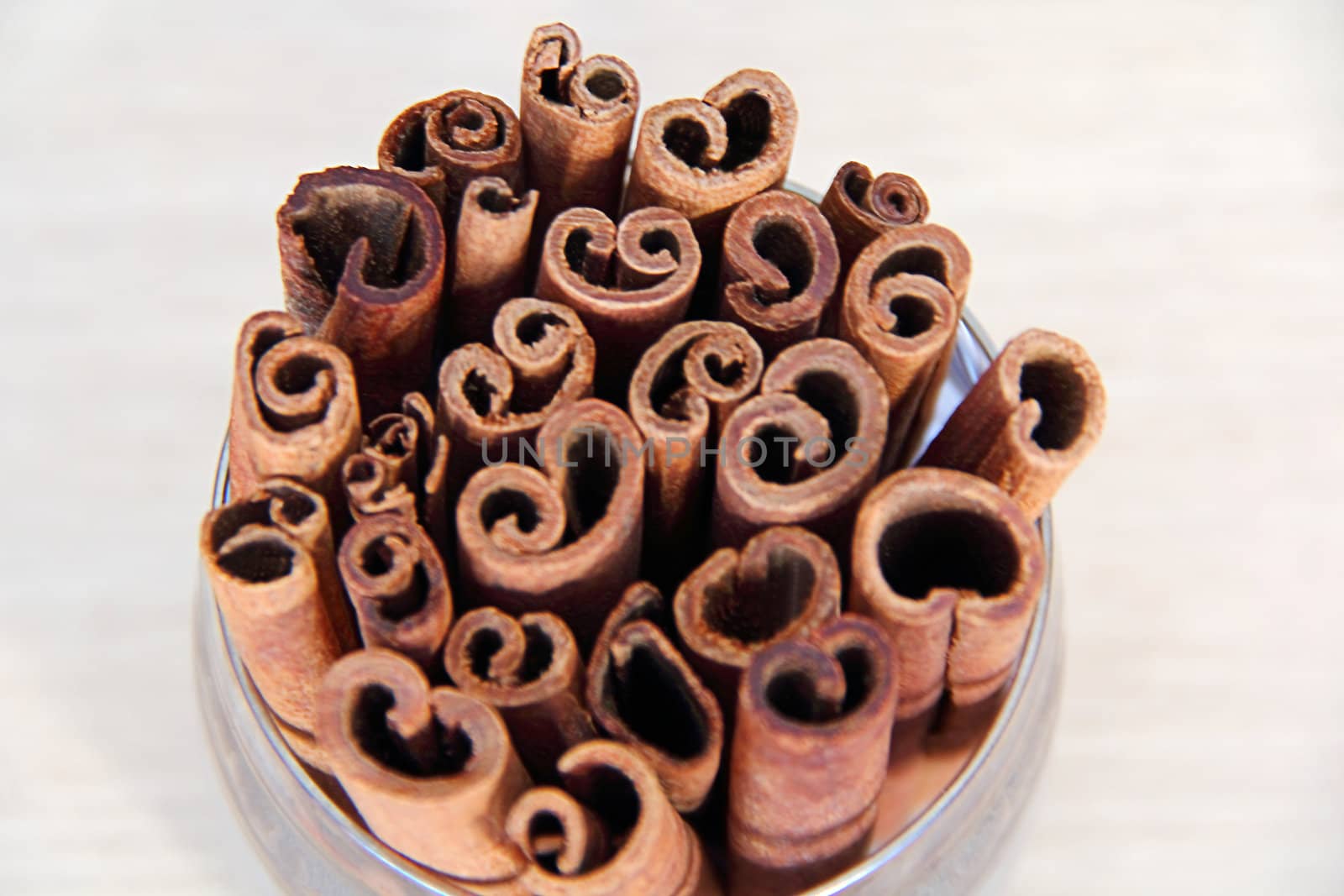 Image of still life with cinnamon in glass