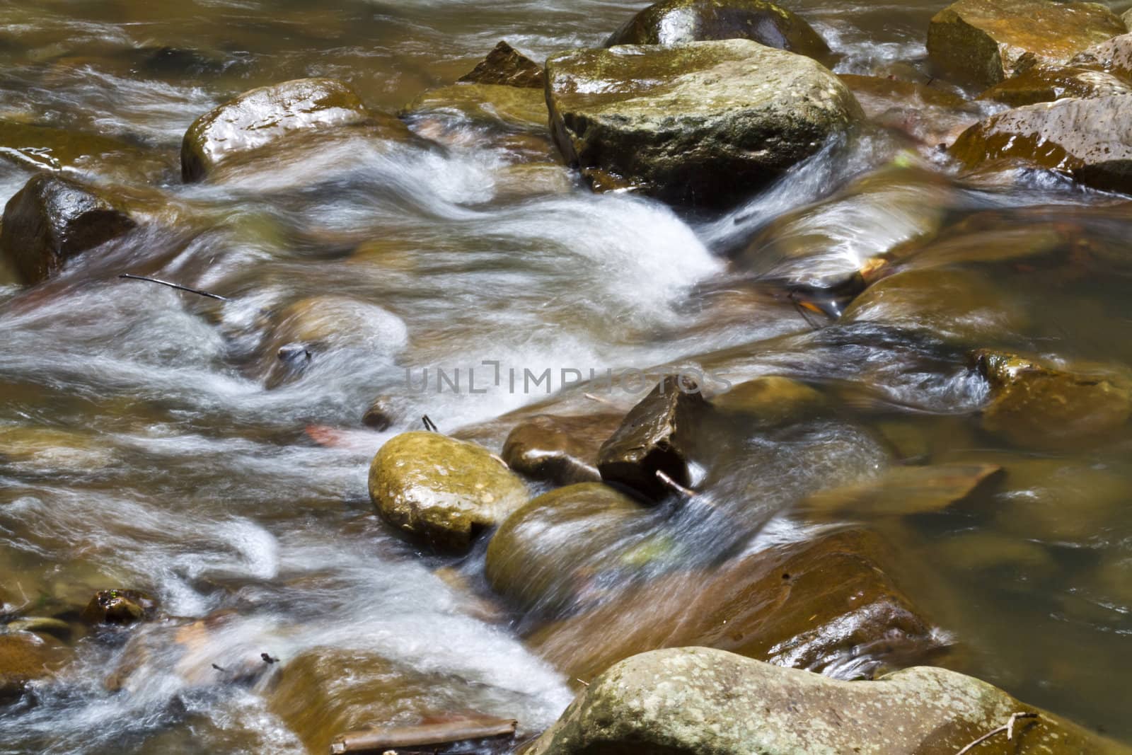 river flow captured by slow shutter release