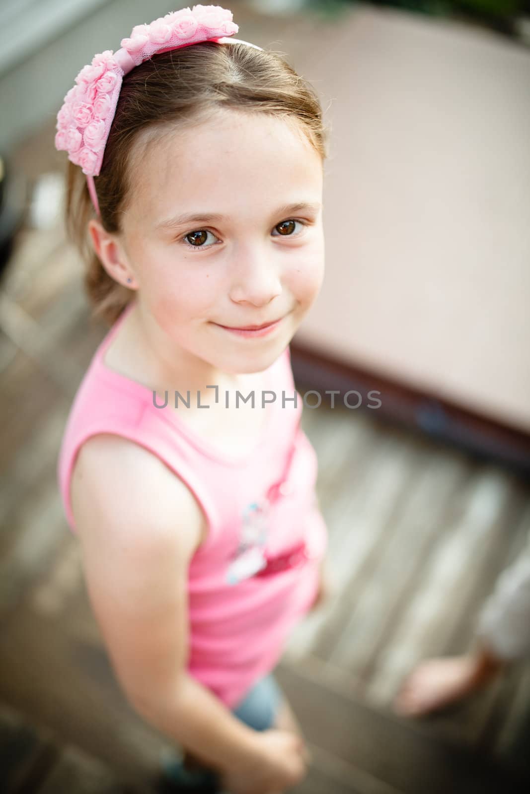 Cute girl smiling outside in summer