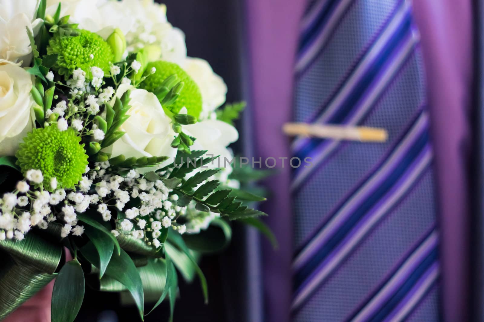 Man hold bouquet in hand