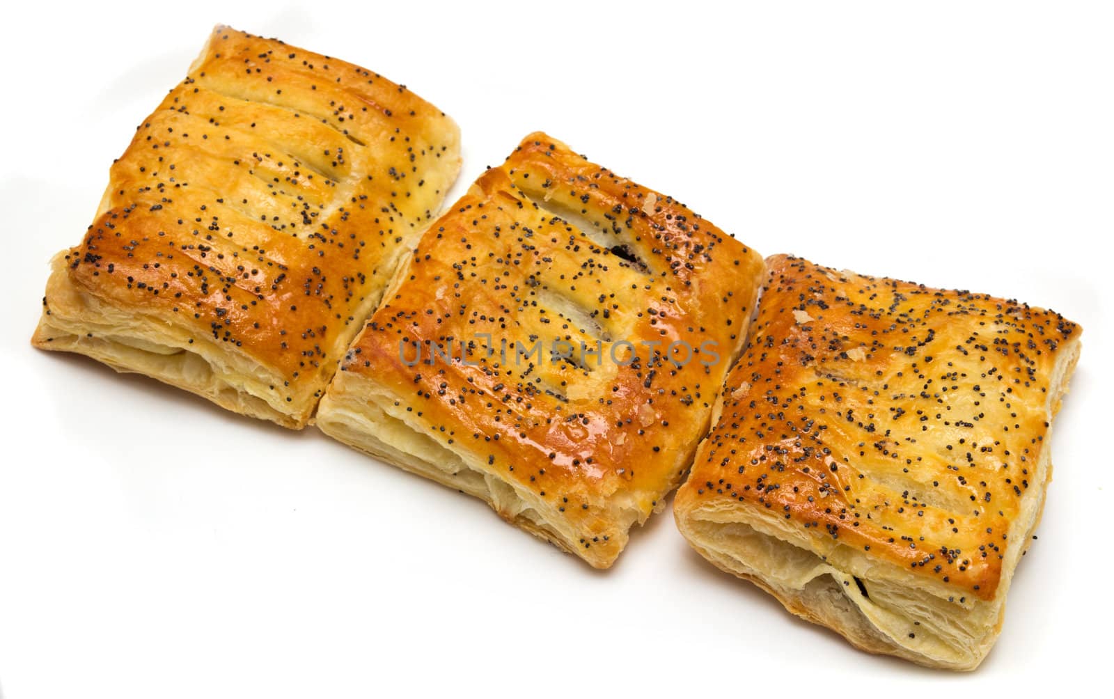 Three rolls with a poppy on a white background