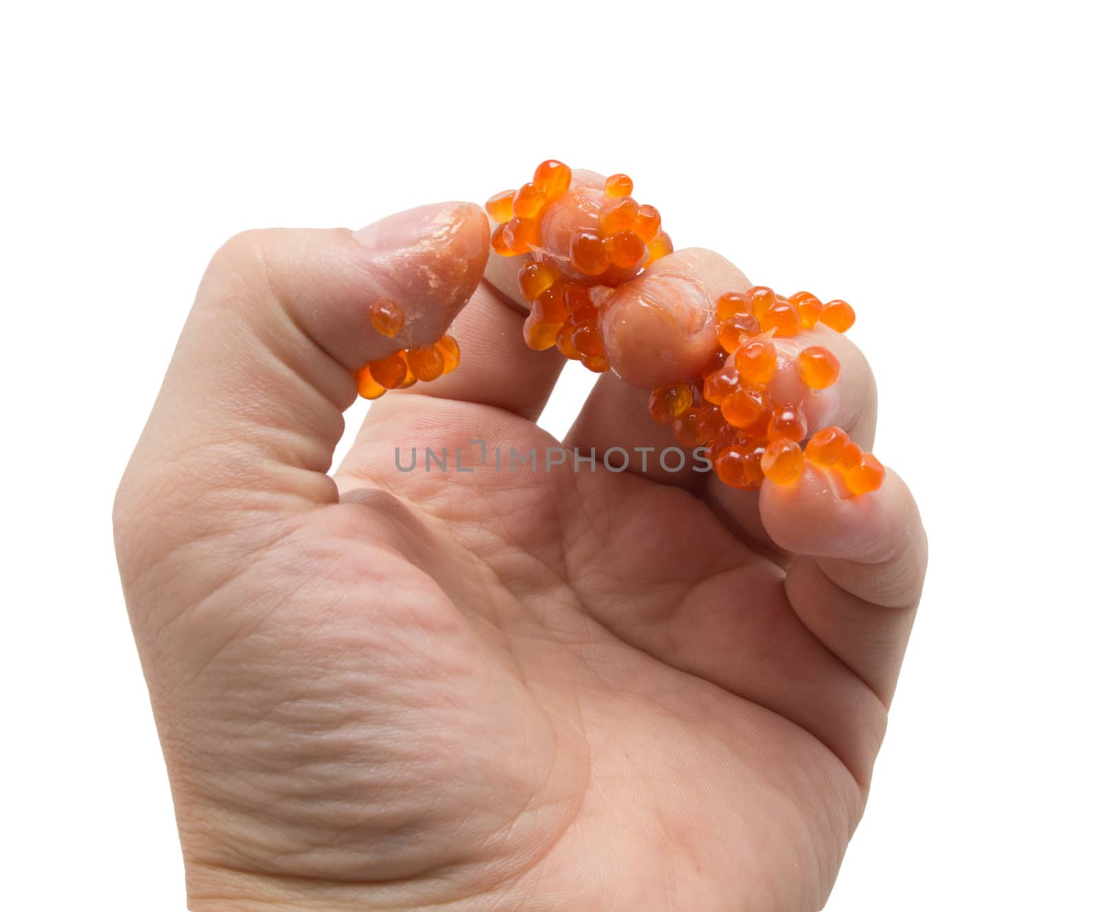 hand in red caviar on white background