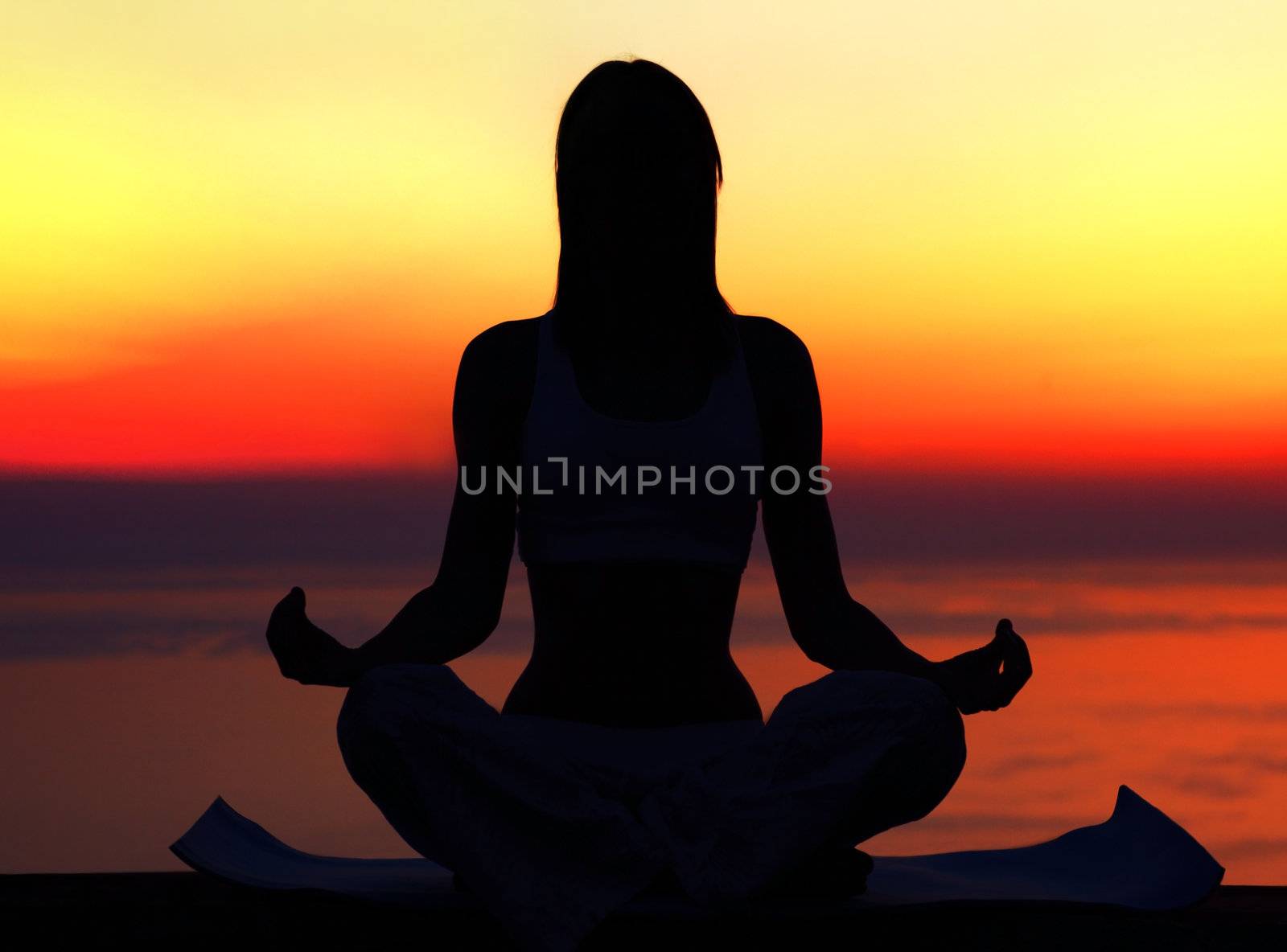 Yoga woman over sunset by Anna_Omelchenko