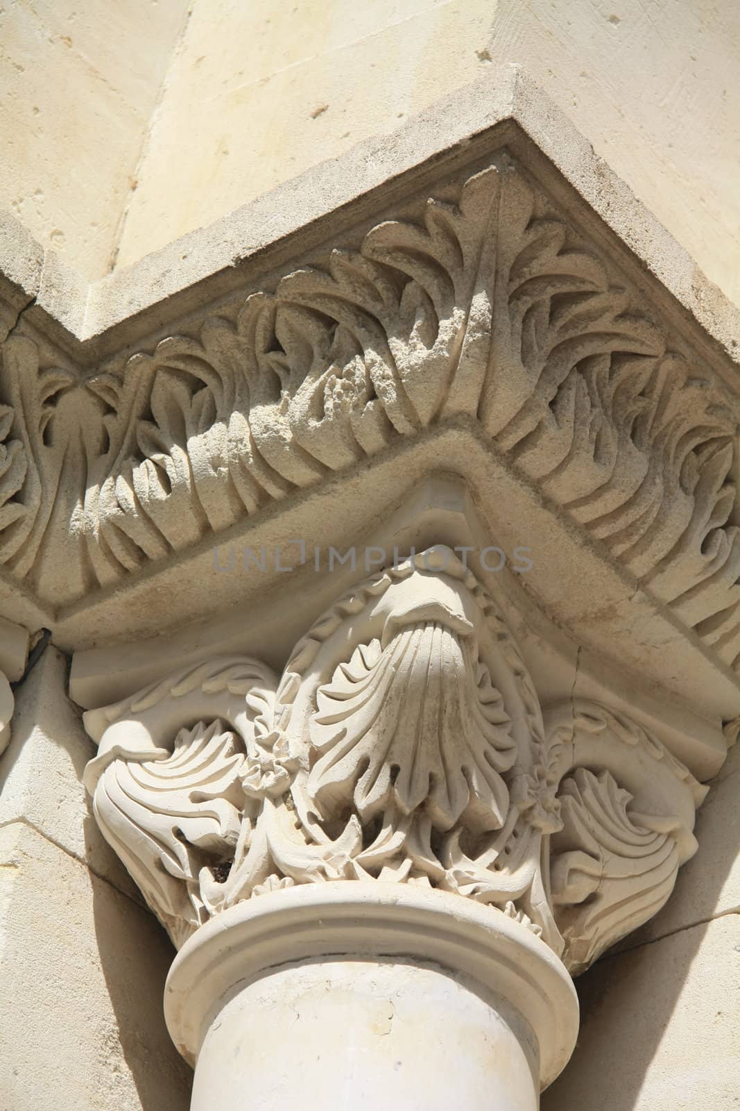 Detail of the facade of an old church in Beaune de Venice, France