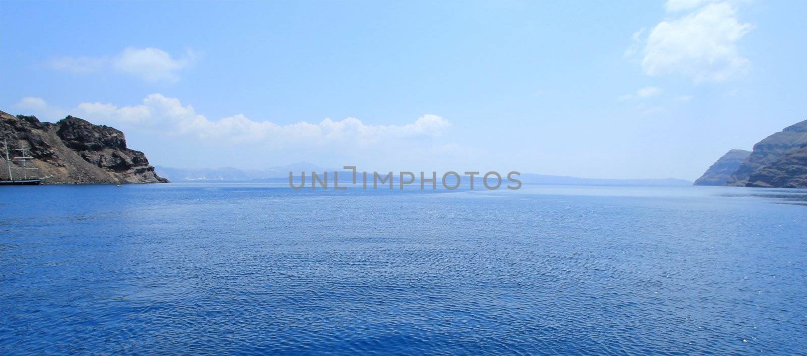 Panoramic view of aegean sea in the cyclades and the volcano from Thirassia island, Greece