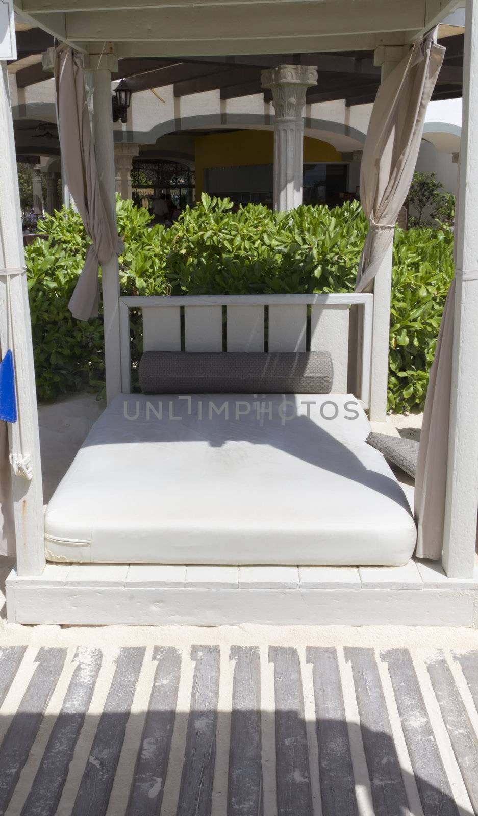 A day bed on the sandy beach