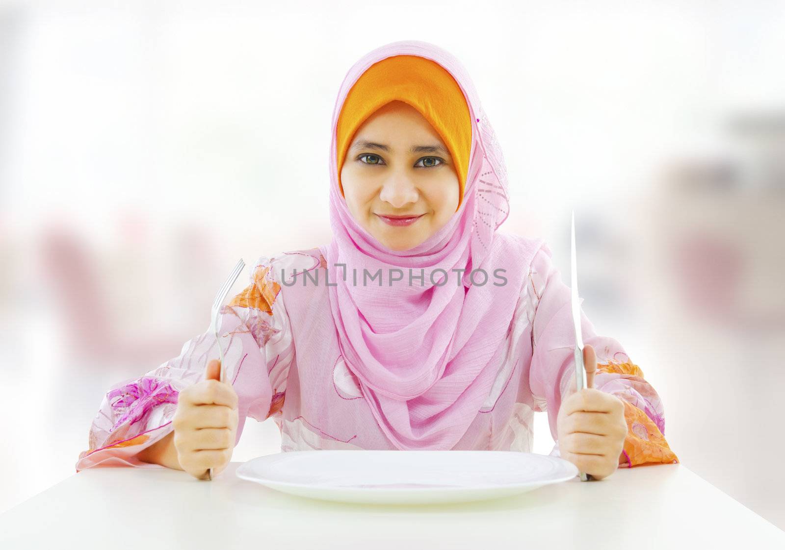 Muslim an and empty food for fork holding inside knife plate ready restaurant with woman 