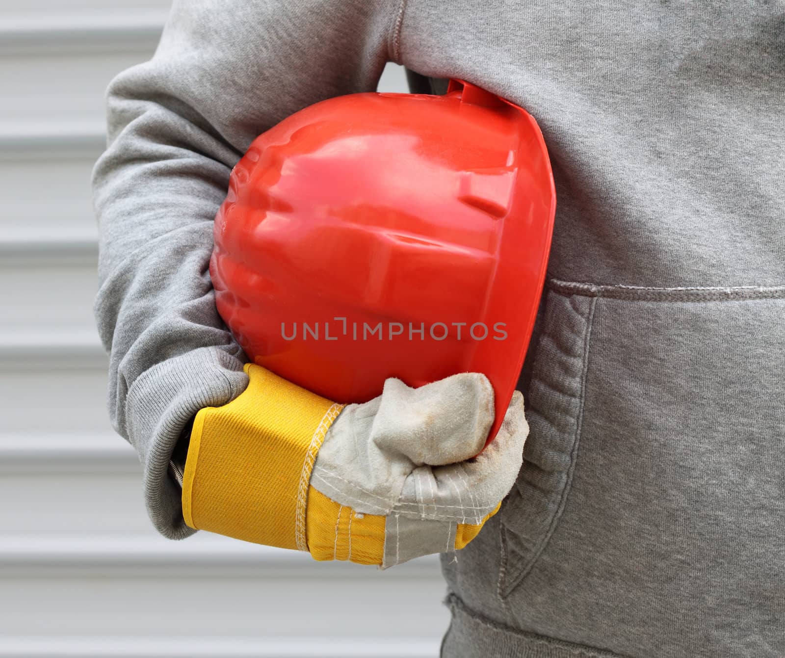 Man holding red helmet close up 