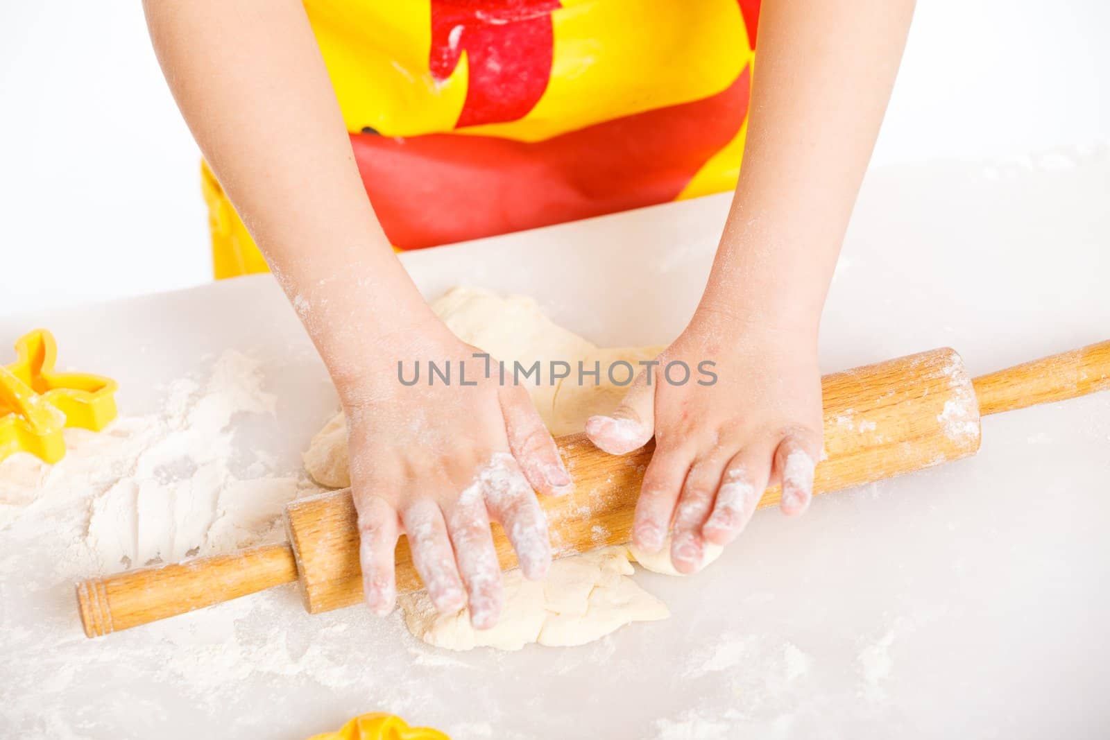 Beautiful hand boys making a cake, isolated on white background.