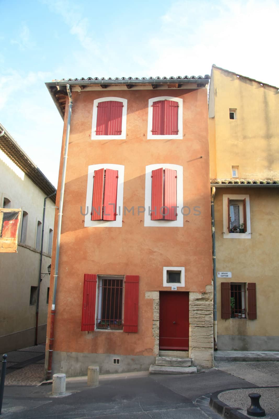 House in typical provencal style in France, windows with wooden shutters