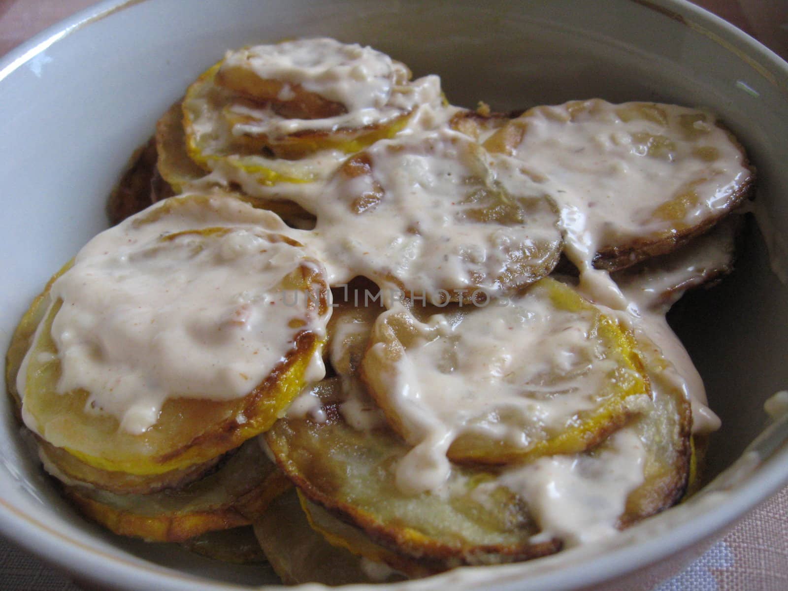 Dish from fried squash in sauce