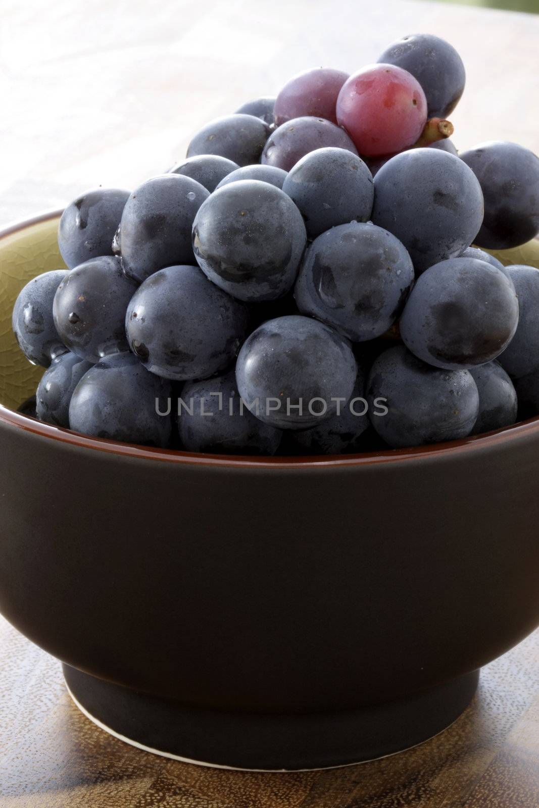 fresh delicious and healthy organic concord grapes on bowl
