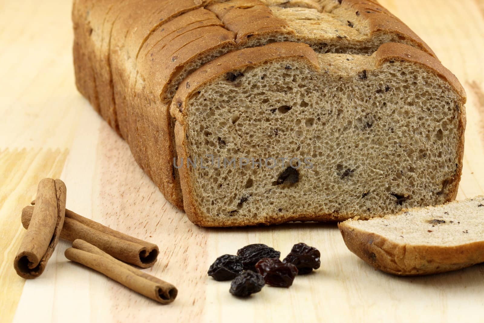 fresh baked  wholegrain whole wheat raisins and nuts bread with lots of assorted healthy ingredients   