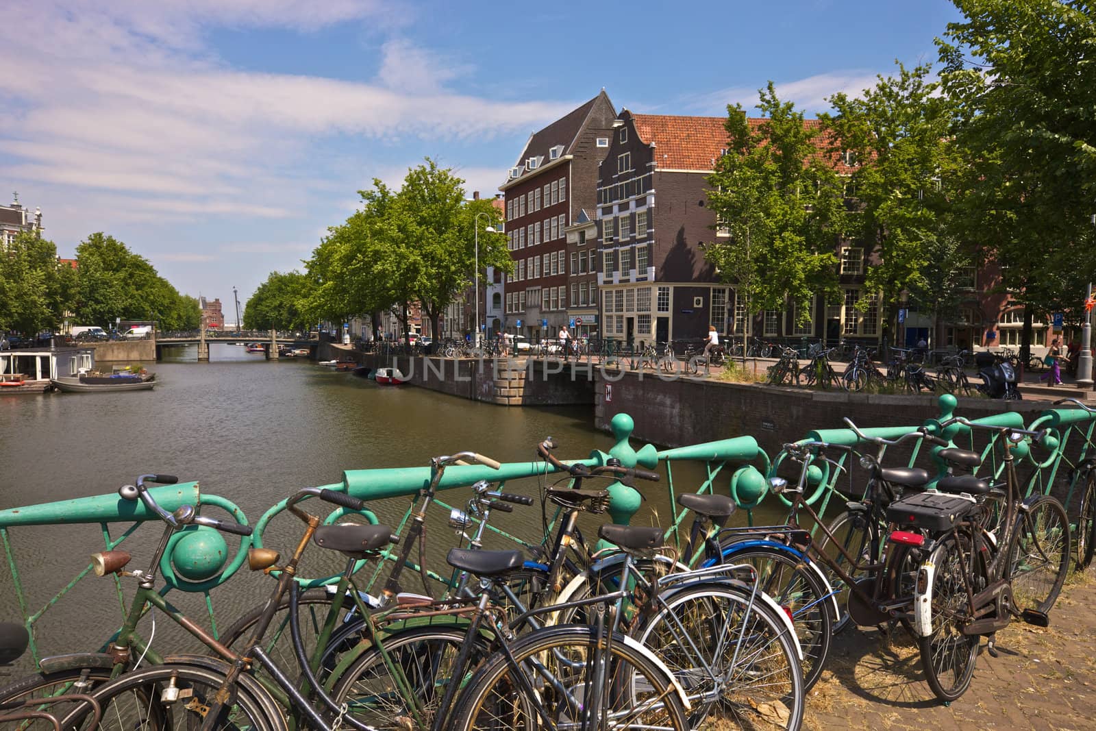 Amsterdam canal and bicycles by johanelzenga
