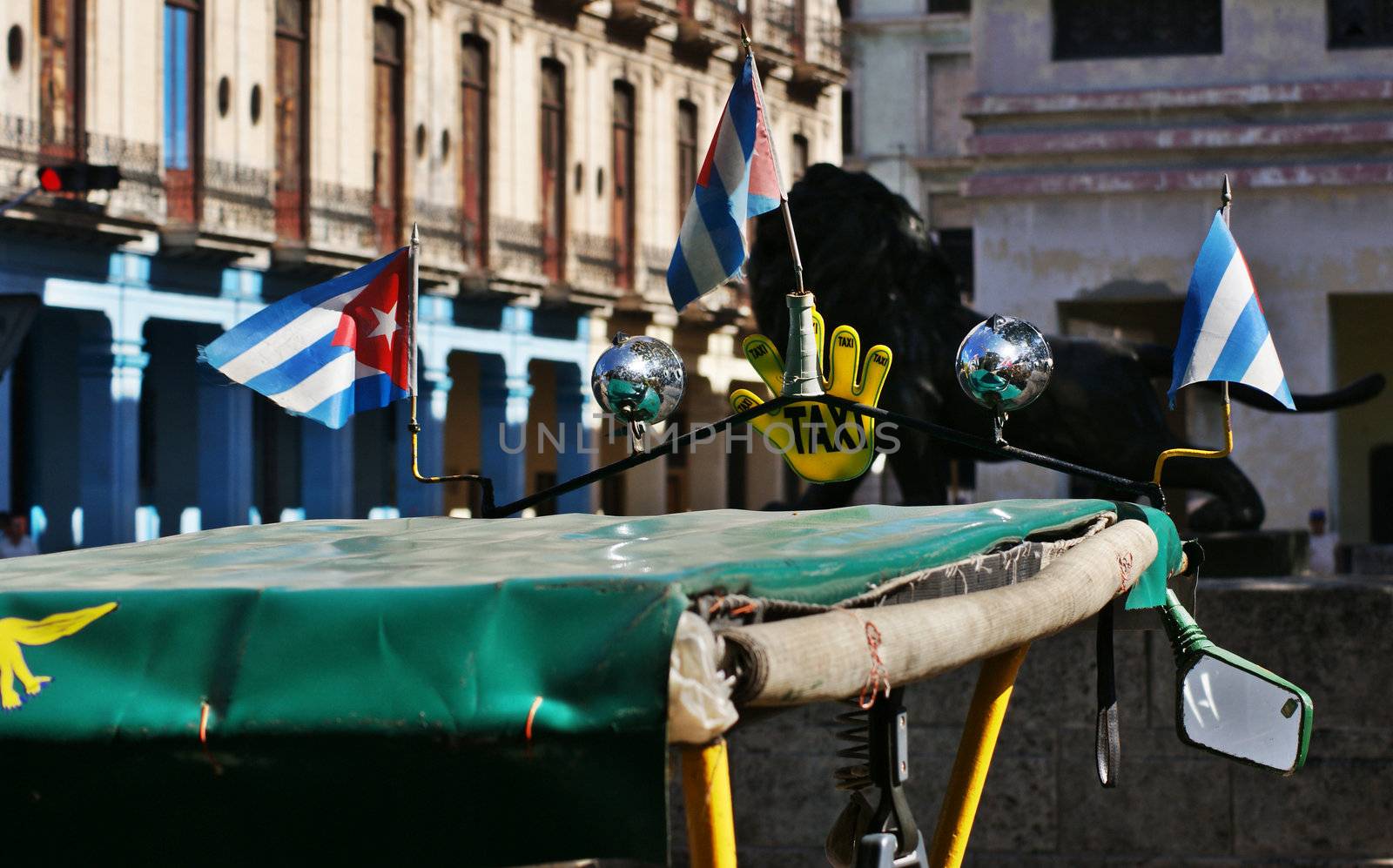 close up to the roof of bici taxi with cuban small flags  in Havana