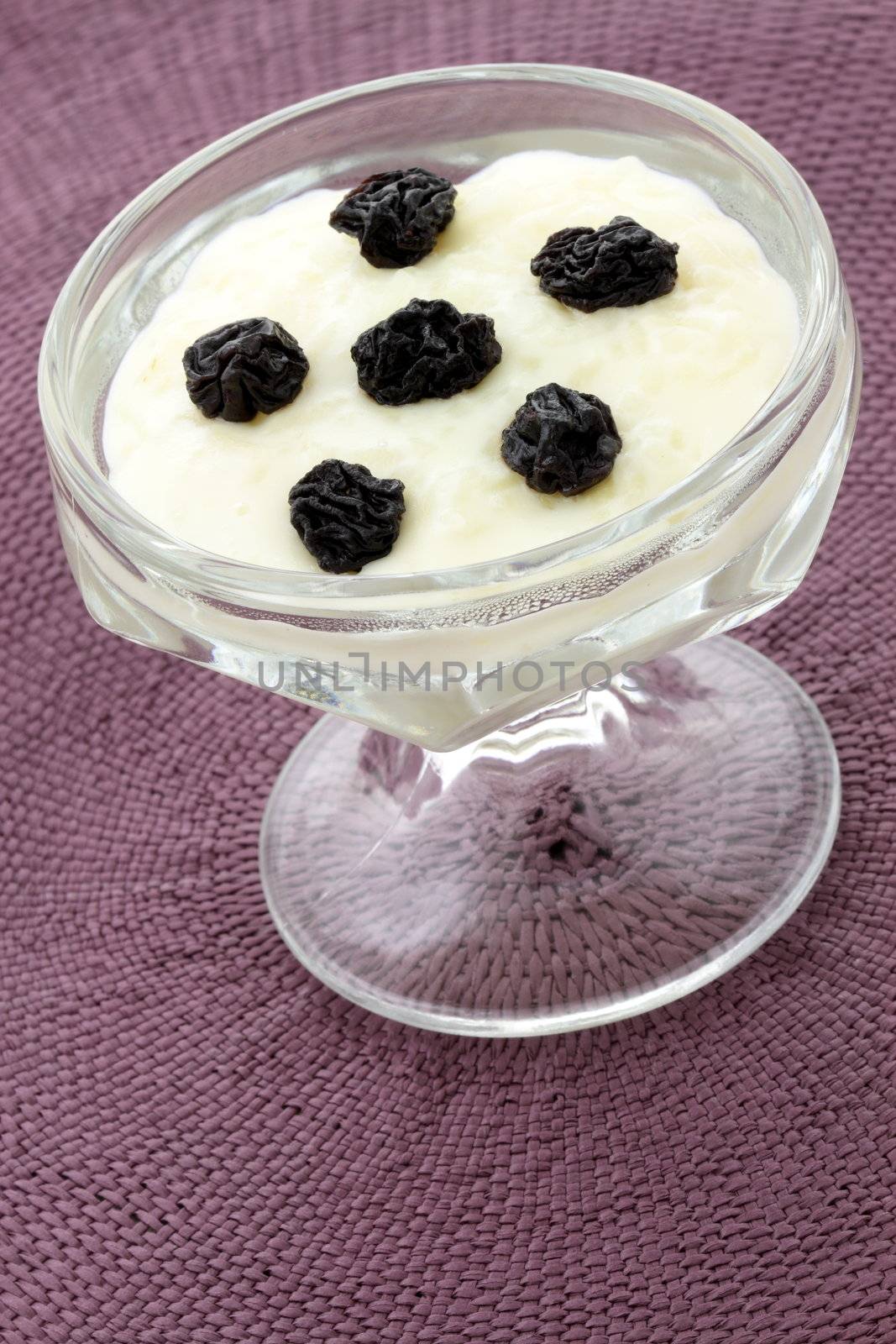 delicious just made warm rice pudding with cinnamon, raisins or brown sugar on top one of the most delicious desserts ever 