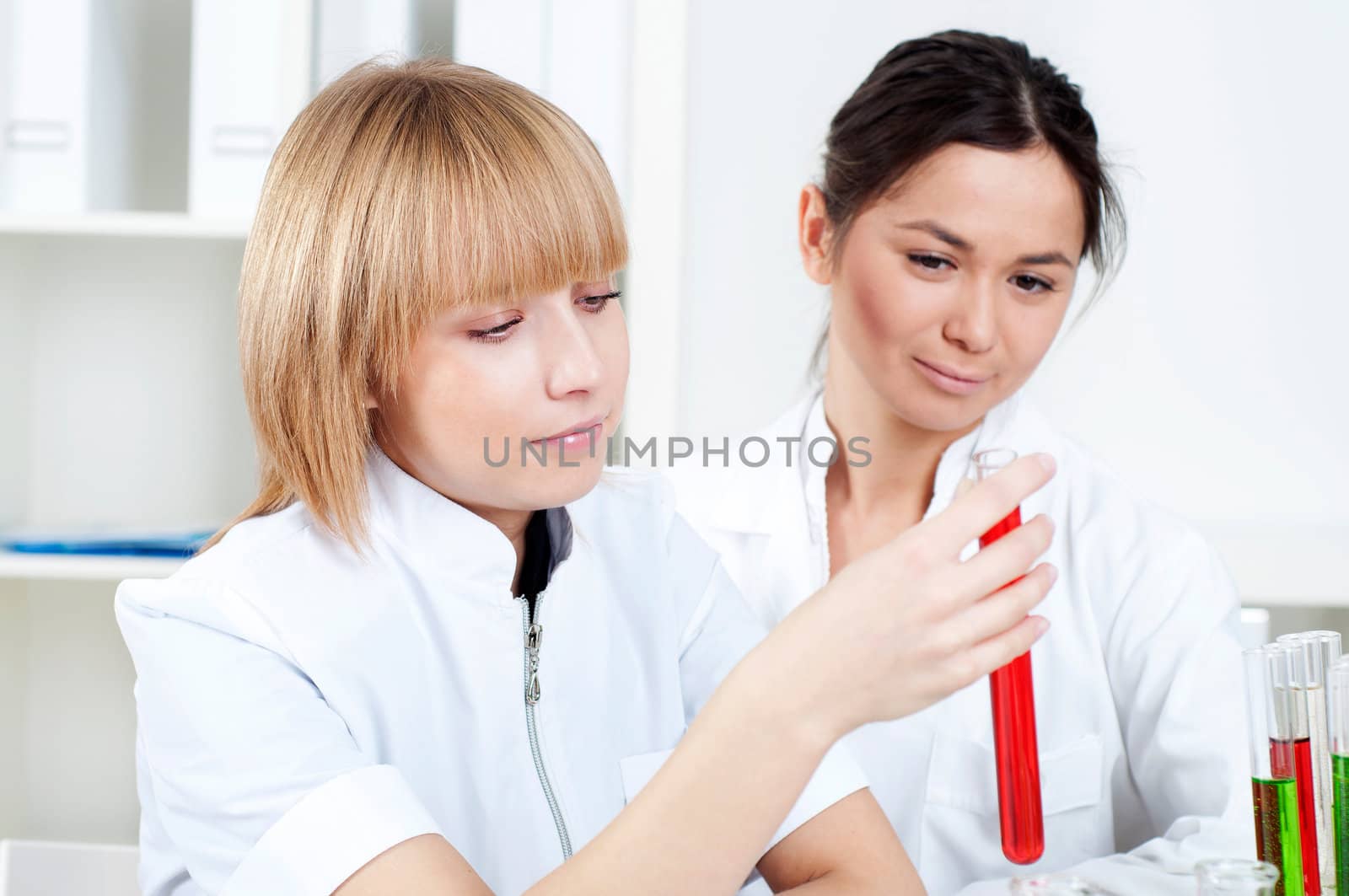 group of scientists working in laboratories with equipment