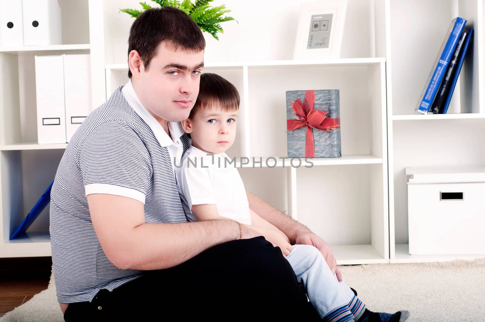 Father and son spend time together, playing at home