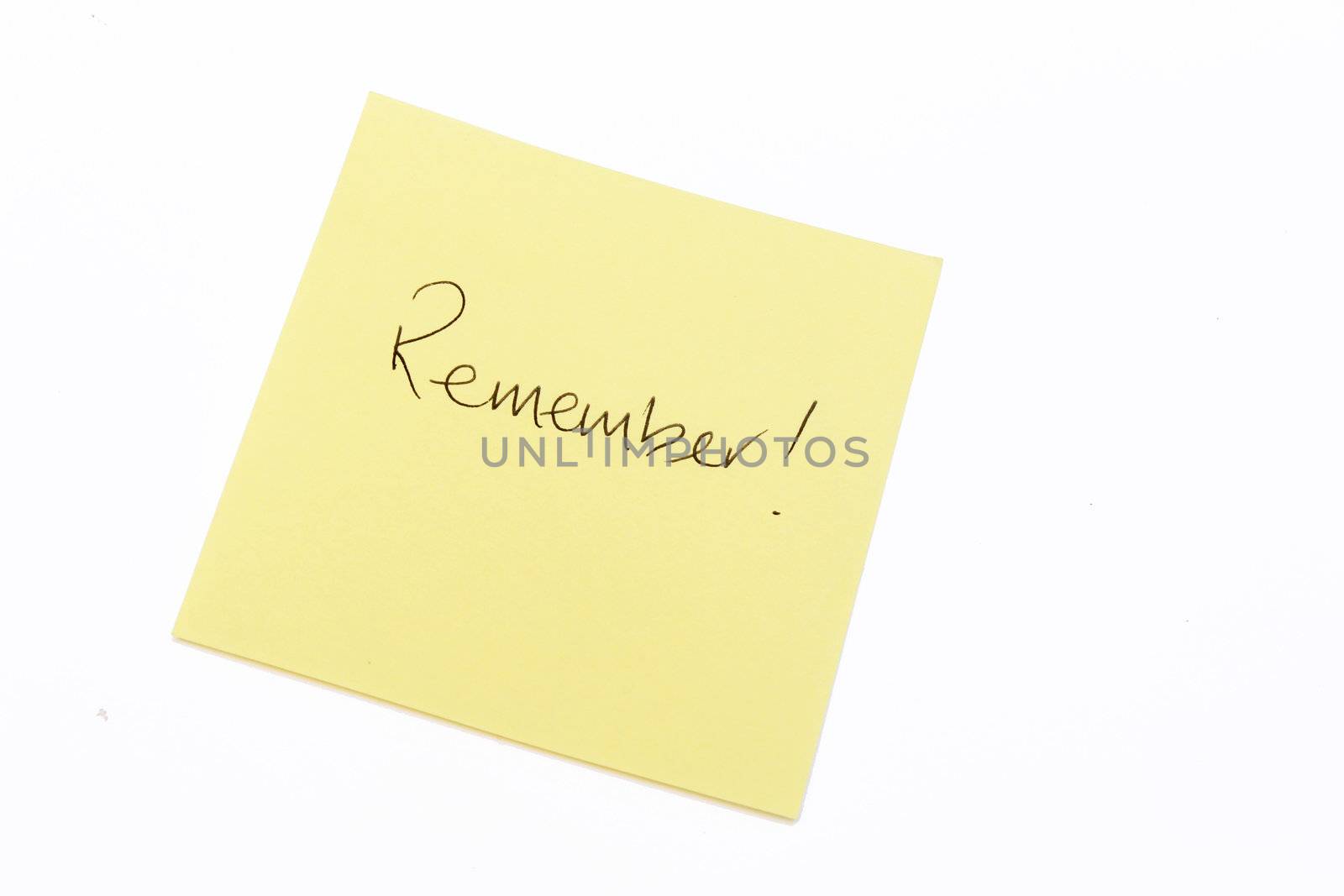 Remember written in black on a yellow post it note
