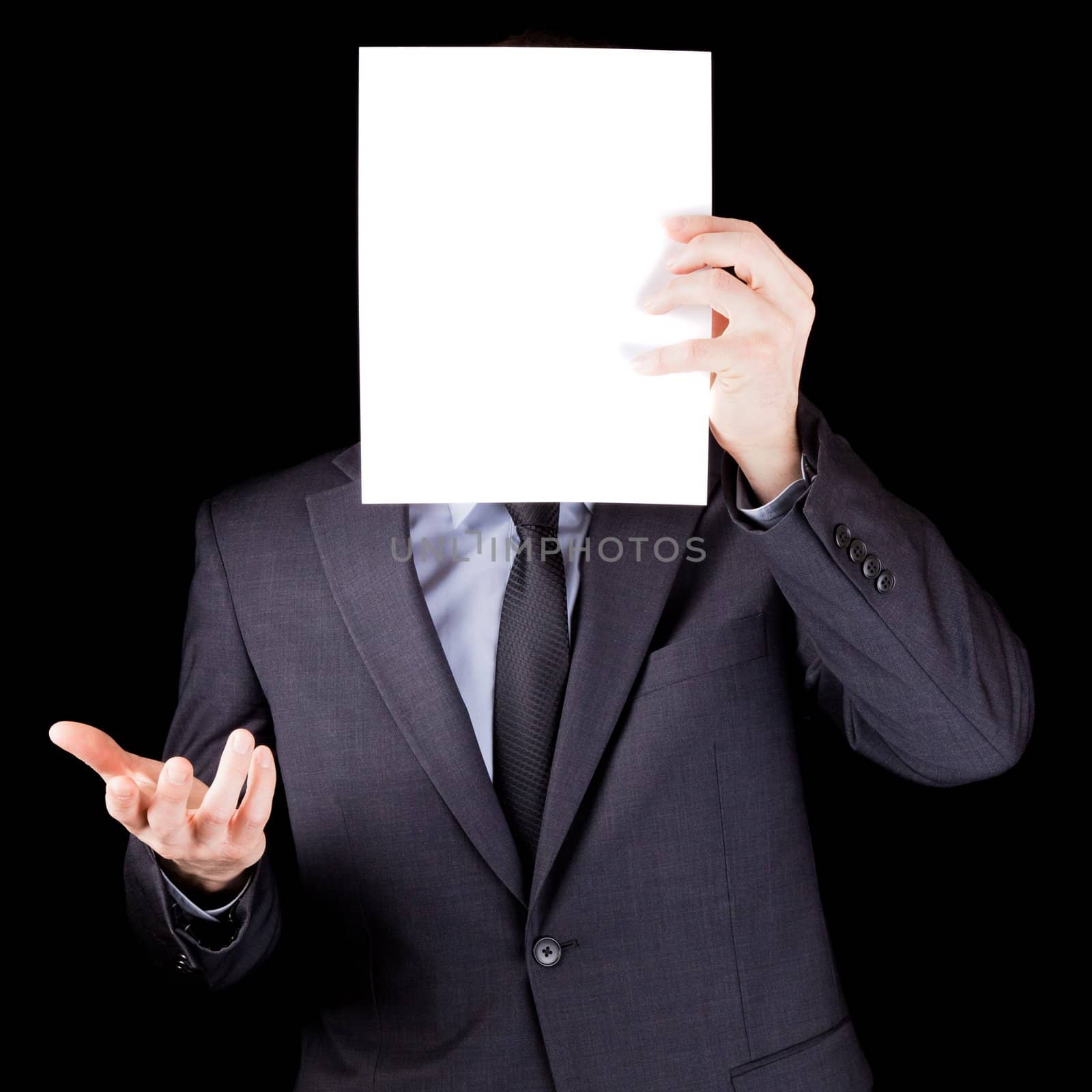 Businessman holding  an empty sheet of paper in front of his face by aetb