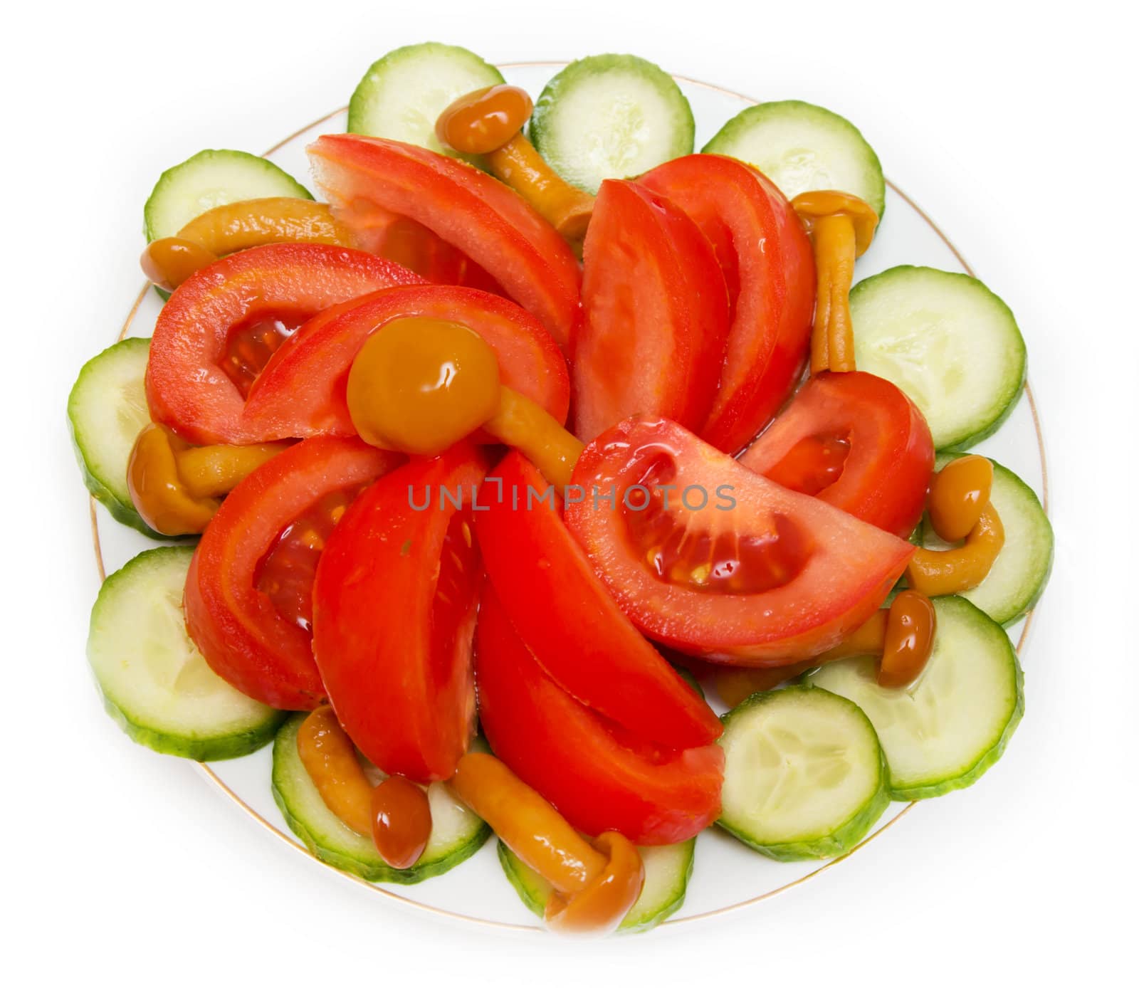 a salad of tomatoes, mushrooms and cucumbers