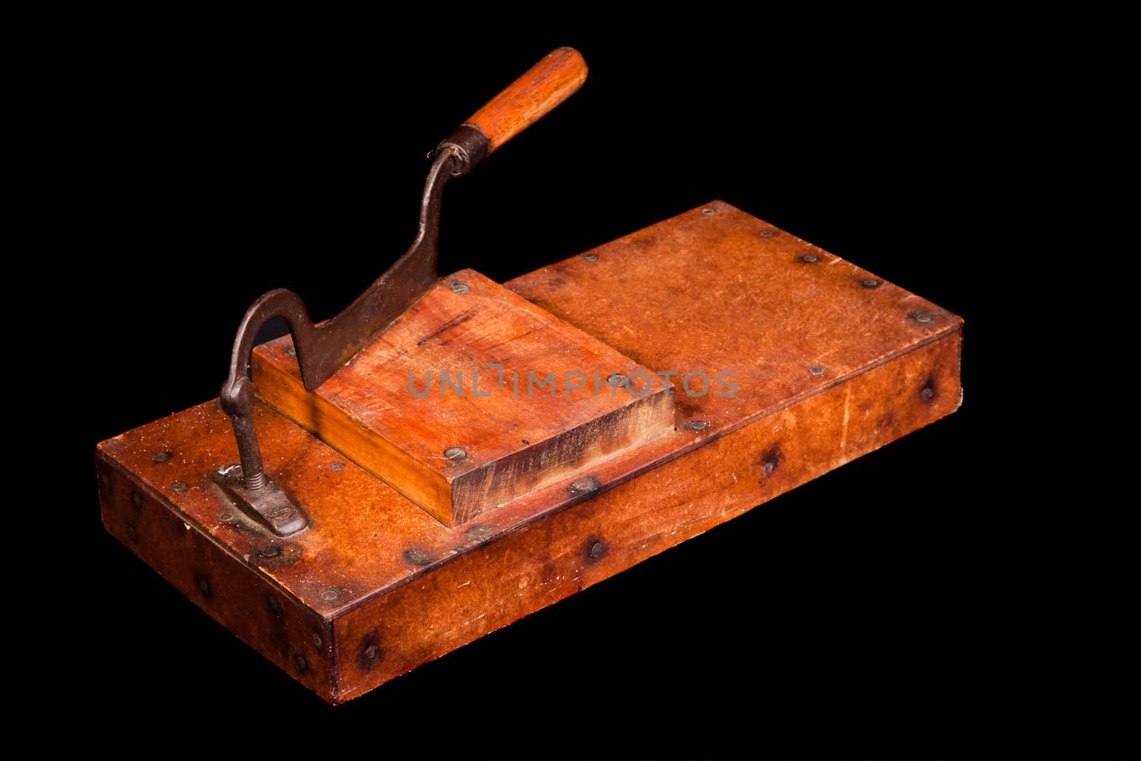 Antique tobacco leaves chopper isolated on black