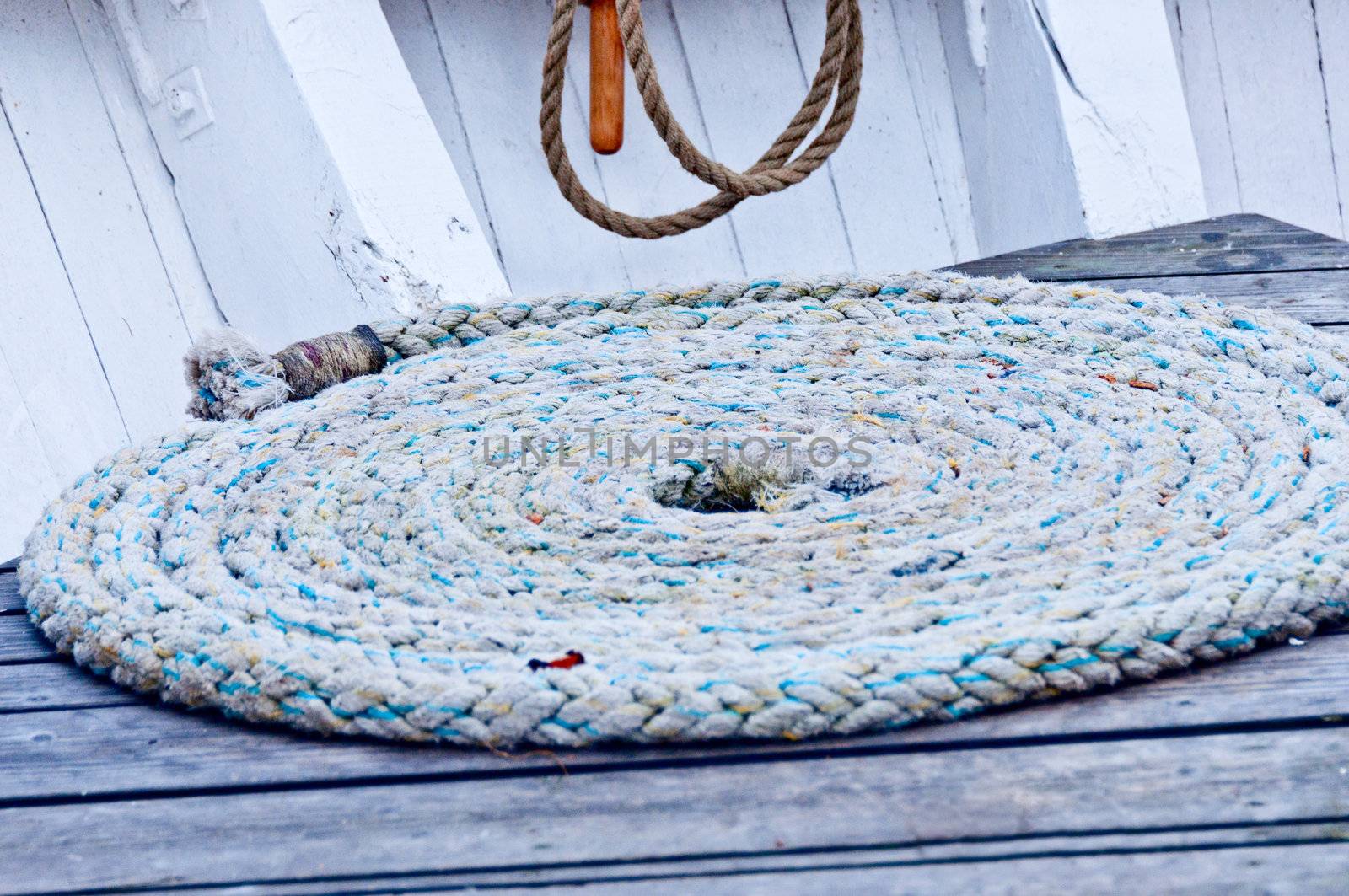 Rope  on wooden background by Nanisimova