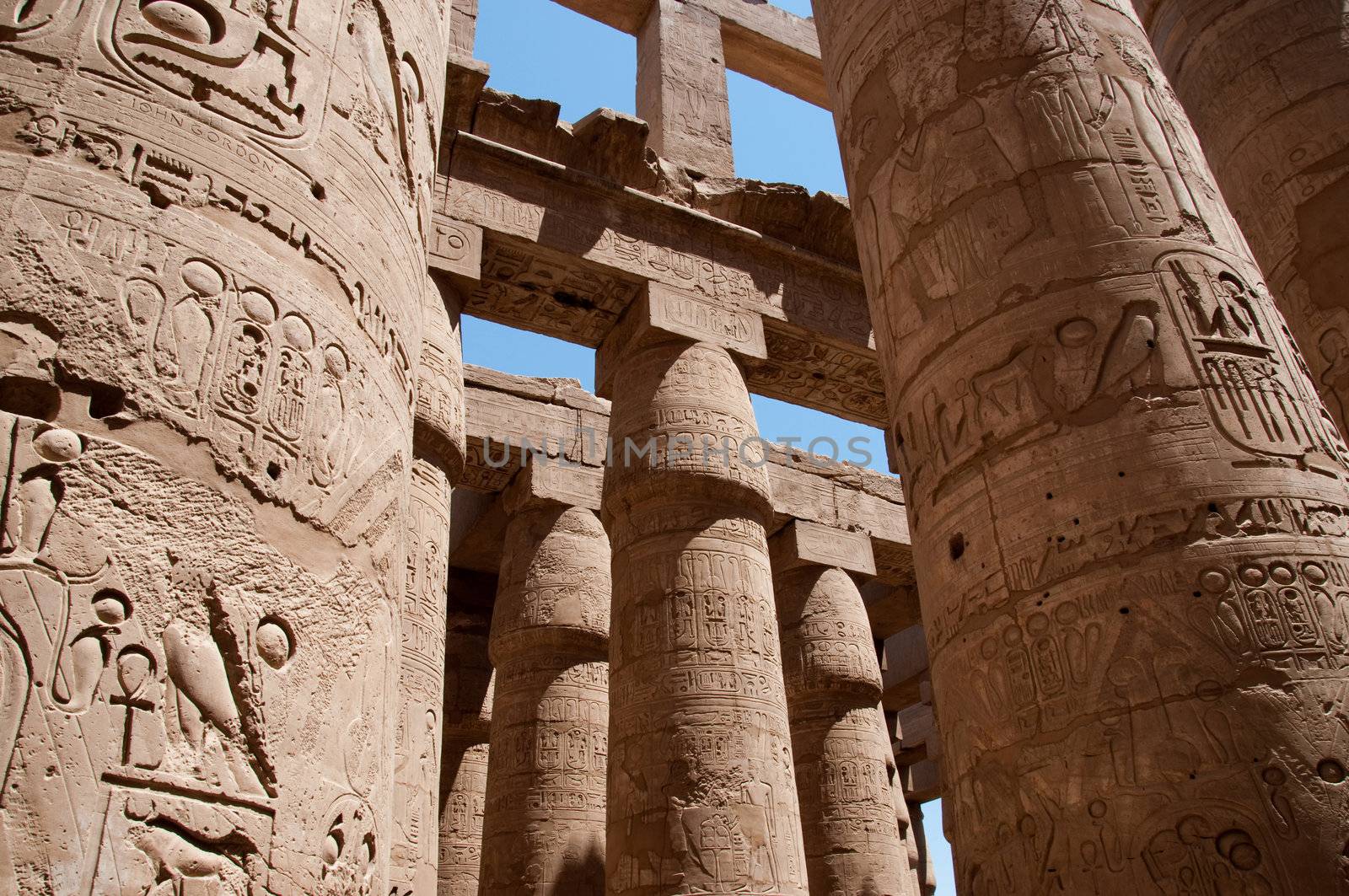 Сolumns ancient temple with old hieroglyphs by Nanisimova