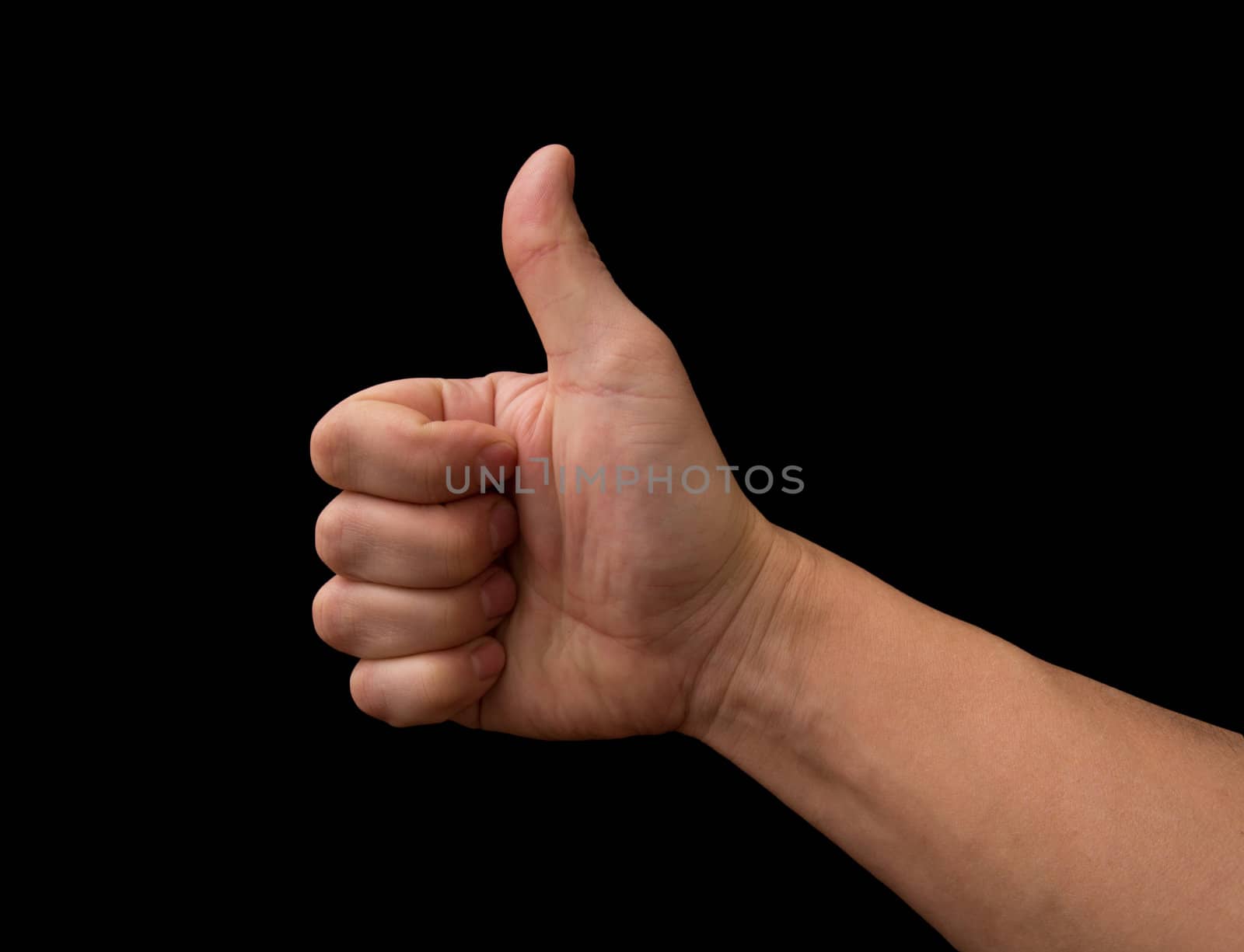 Thumb up hand isolated on black background 