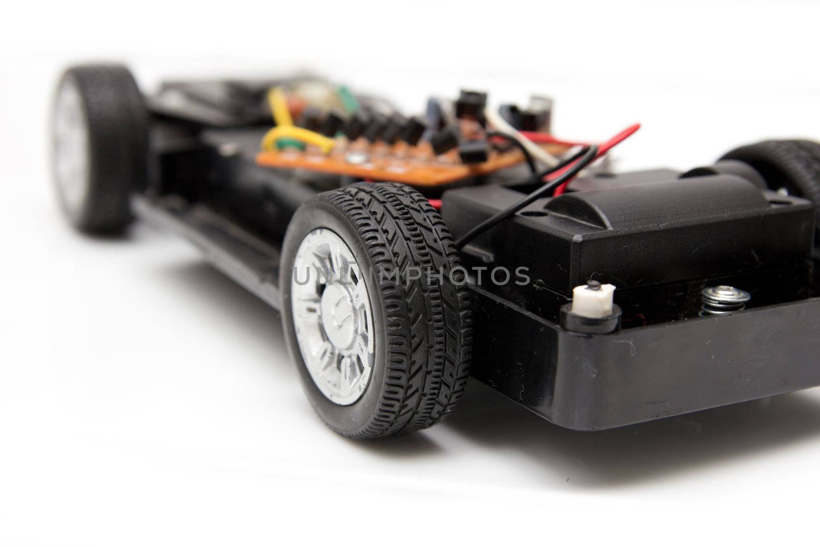disassembled toy car on a white background
