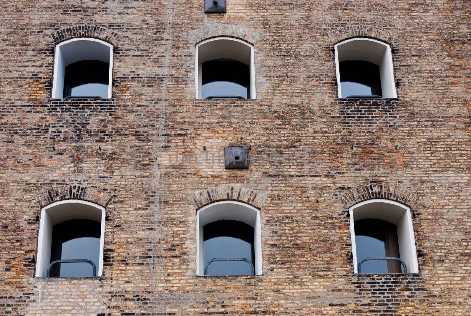 Old brick building with windows in a row