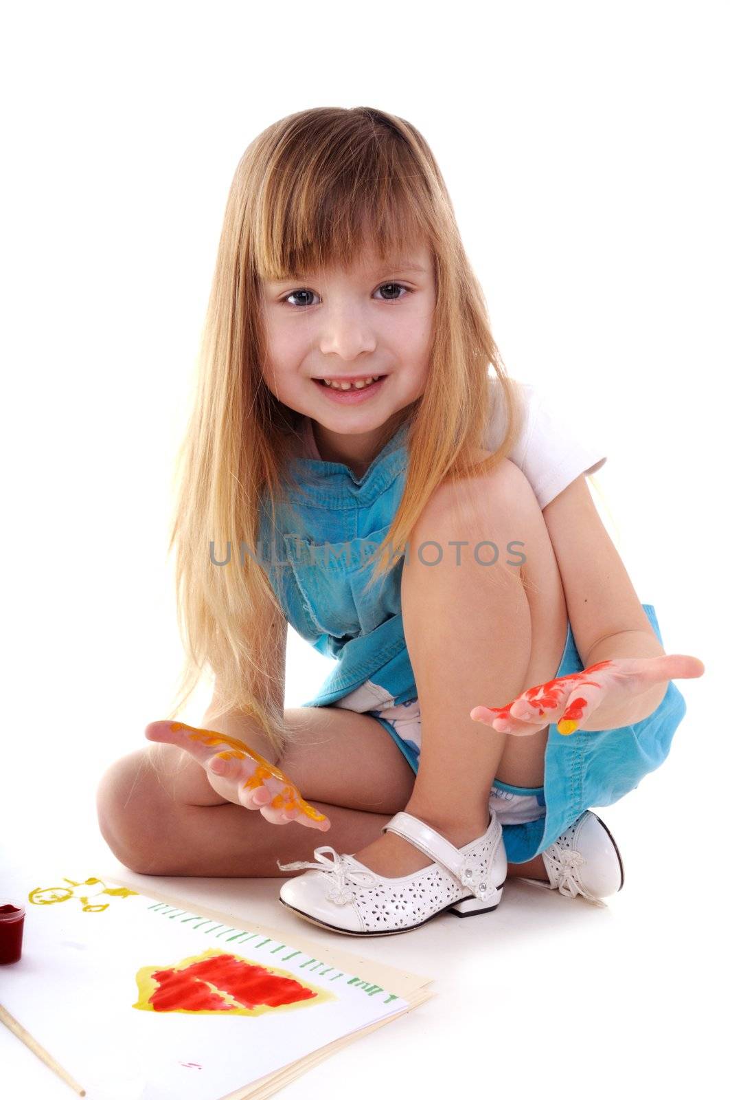 Small playful beauty girl with many-coloured hands and painted home on white background