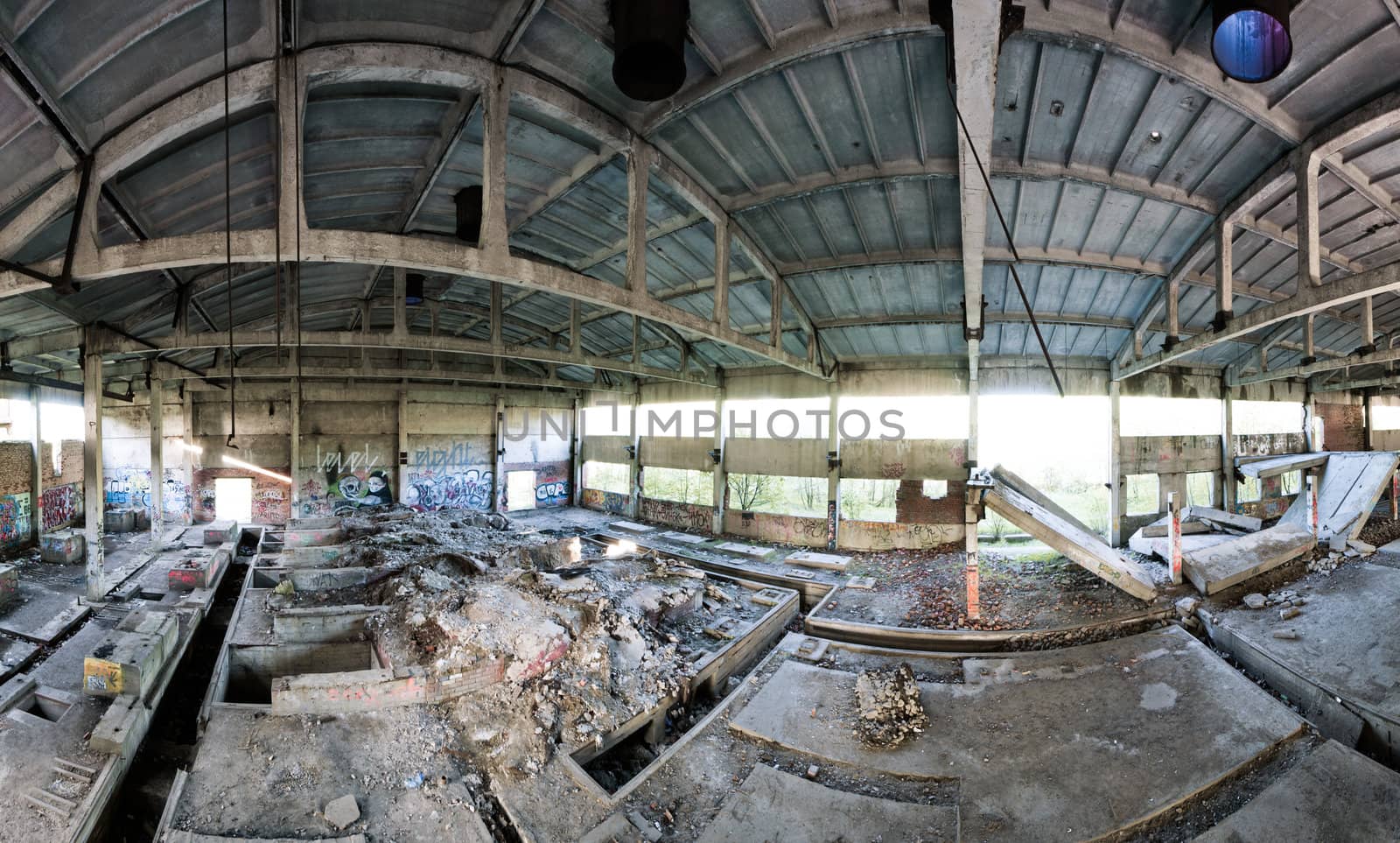 Abandoned factory panoramic interior at day time, view from second flour