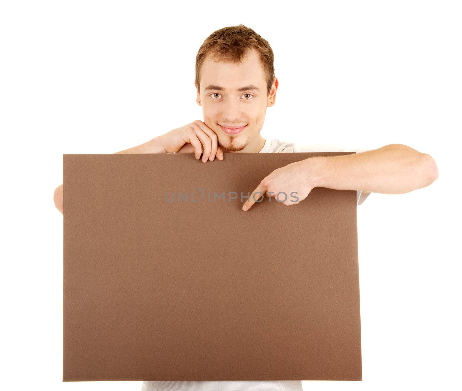 Young man shows by finger on a brown empty board for your text
