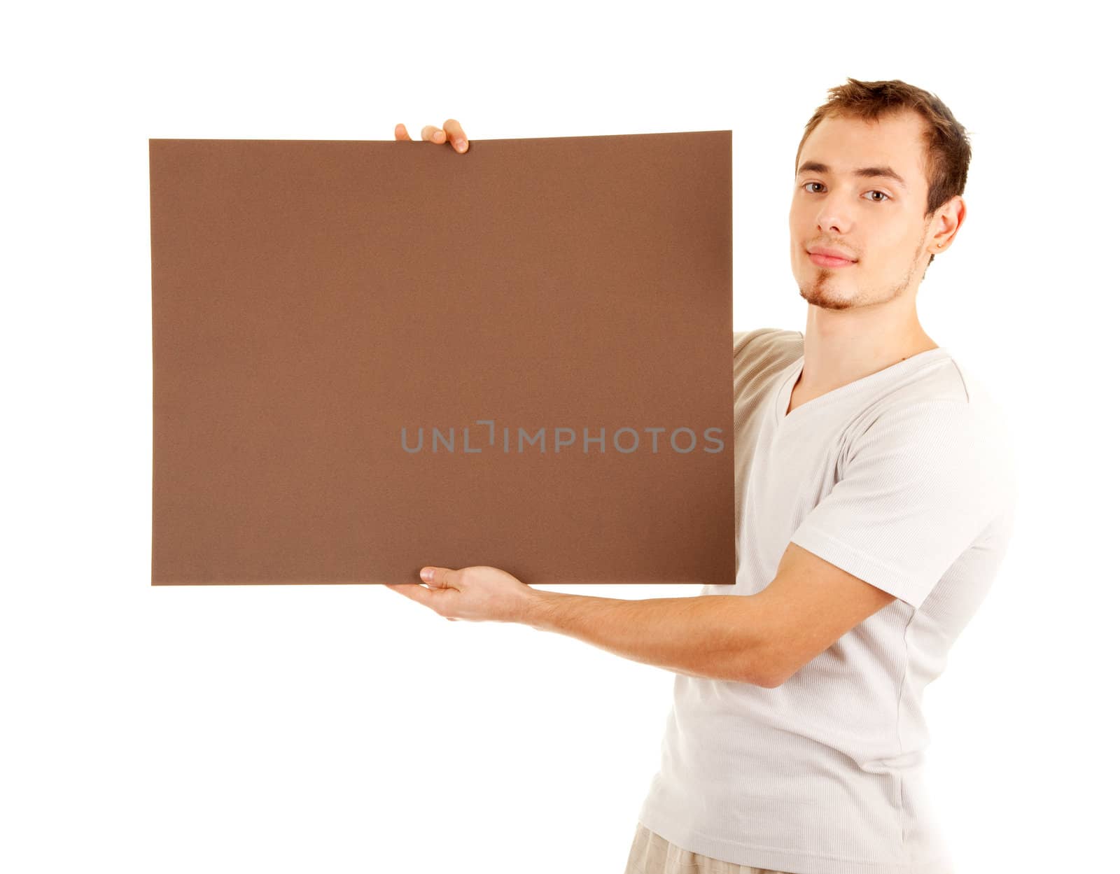 Young man in casual clothes with brown empty board for your text