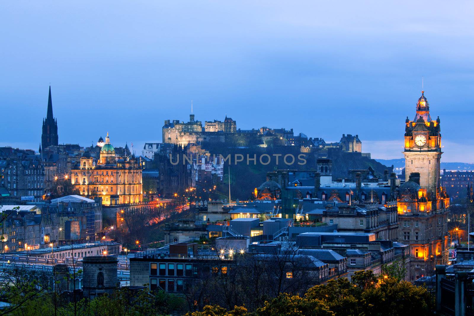 Edinburgh Cityscape and castle from Calton Hill at dusk Scotland UK