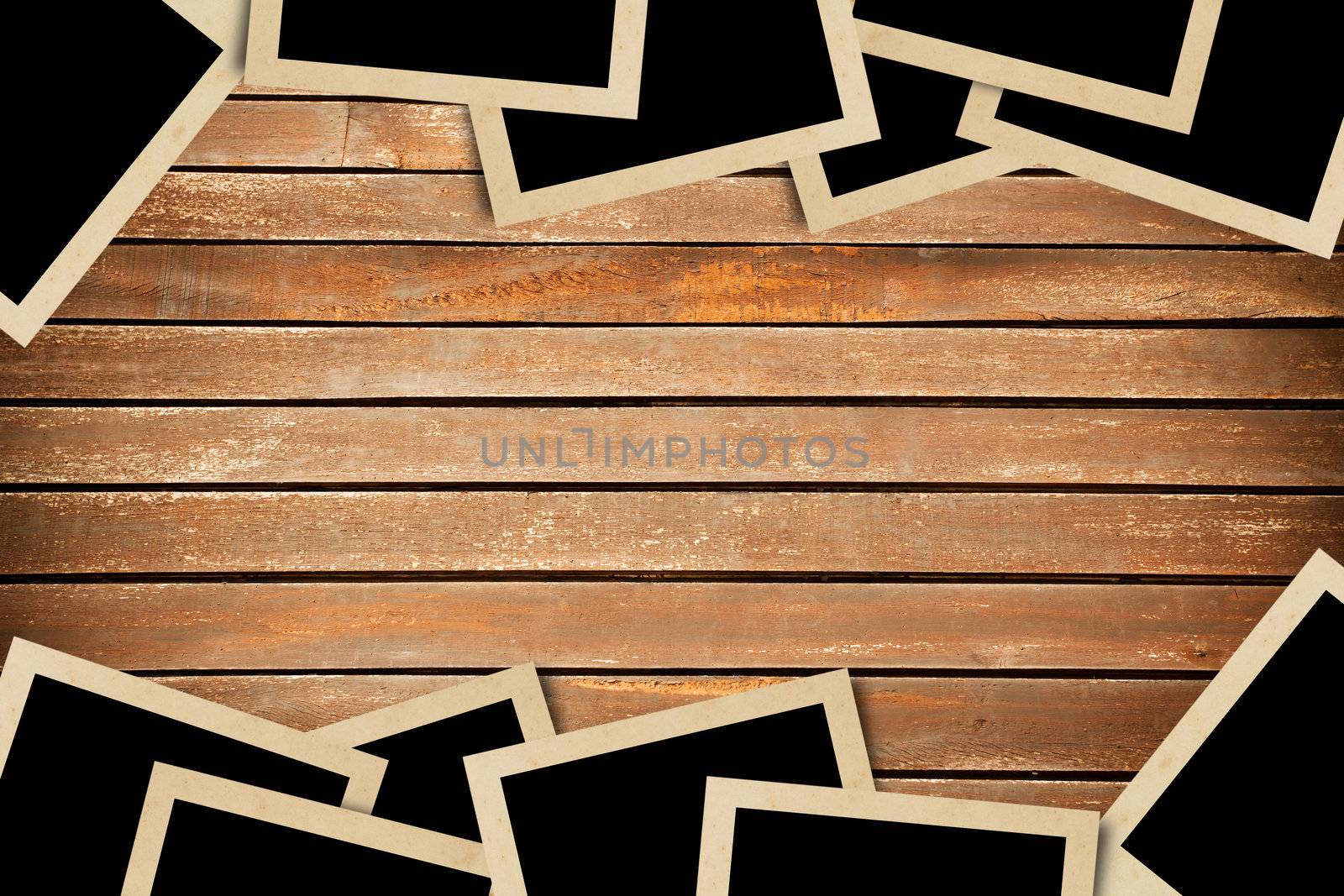 Blank photos frames on wood background