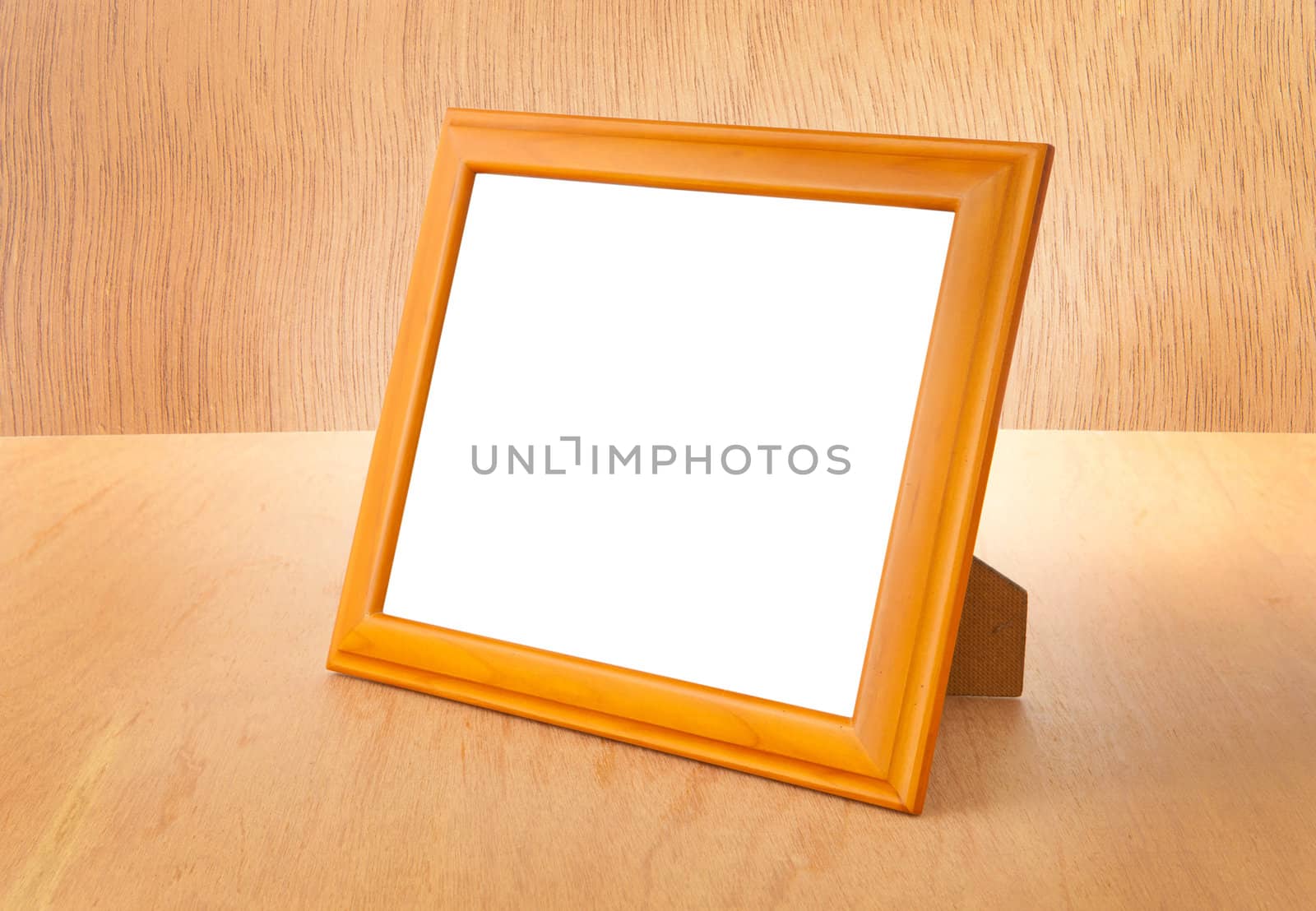 Photo frames on the table and wood background