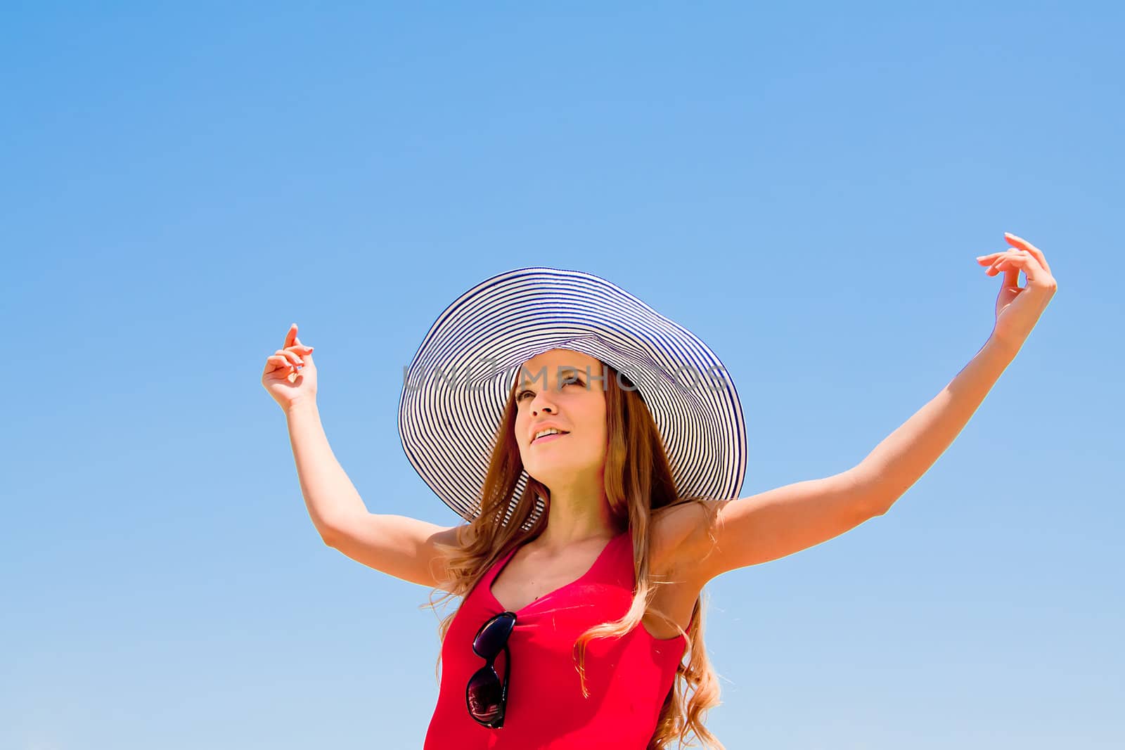 happy young beautiful girl  in the sky