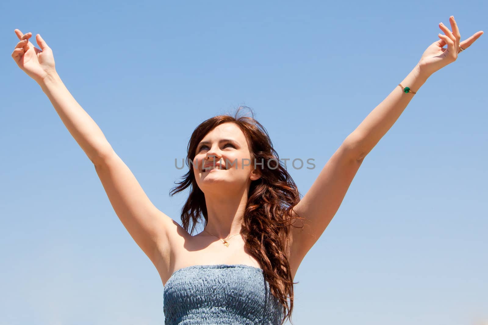 happy young beautiful girl  in the sky