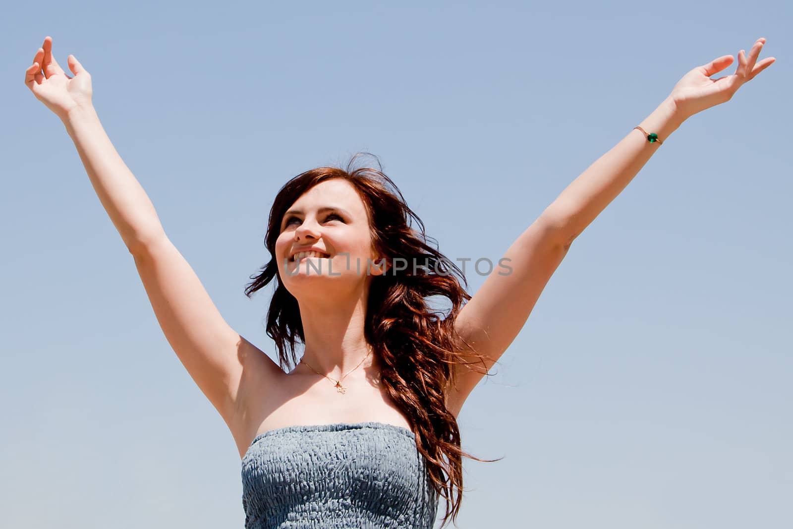 happy young beautiful girl  in the sky