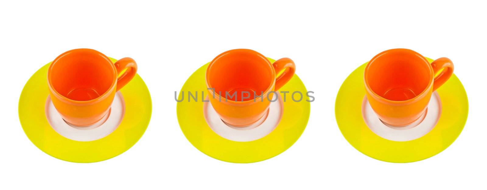 three orange cups on green plate