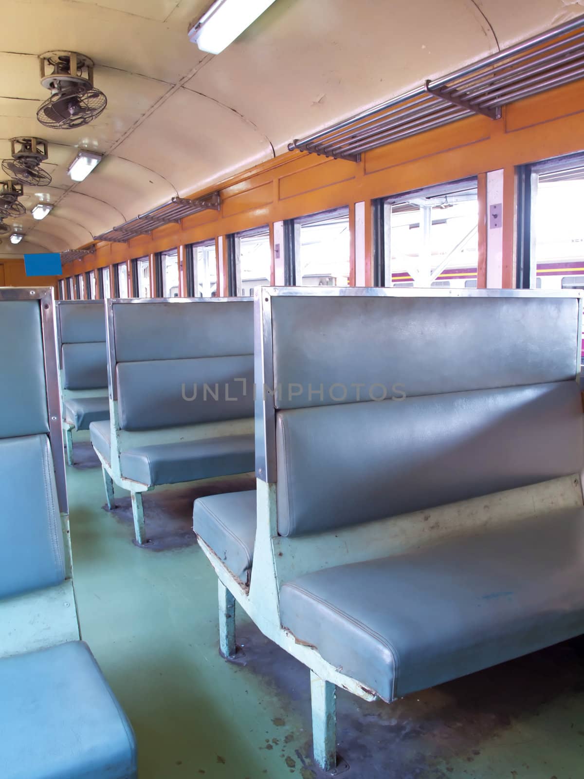 Inside of a vintage train passenger carriage in Thailand