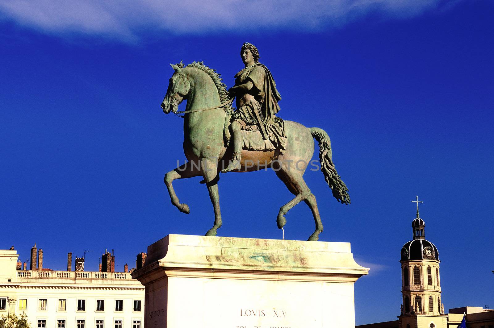 In the centre of Place Bellecour(Lyon,France) stands an equestrian statue of King Louis XIV, to the afternoon